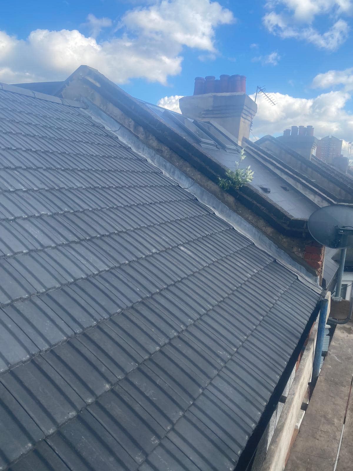 Professional roofers working on a property in London - KS Roof Master