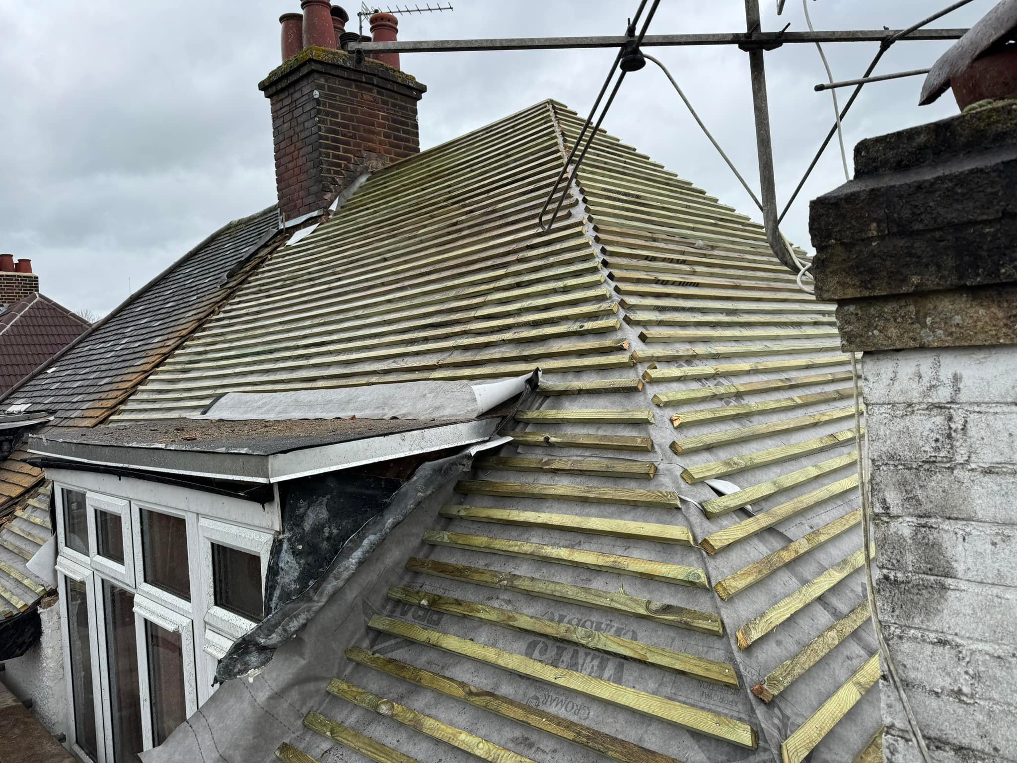 Professional roofers working on a property in London - KS Roof Master