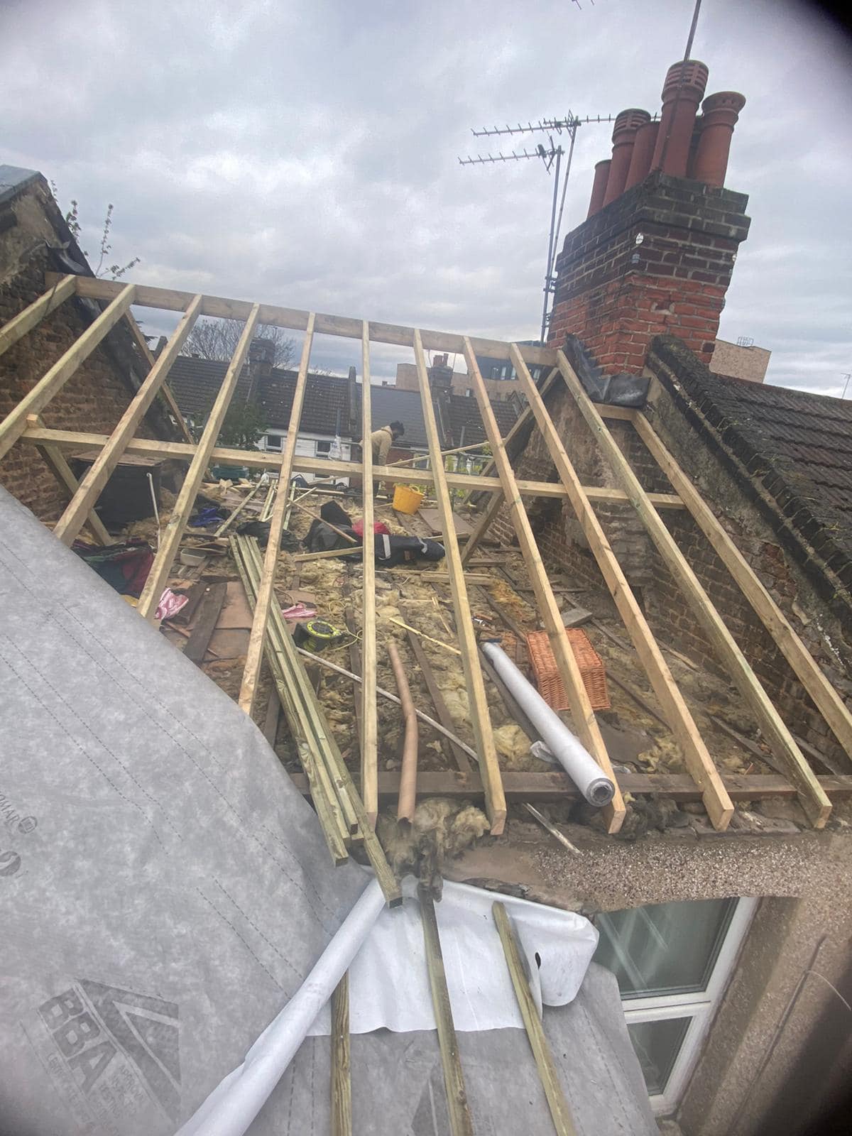 Professional roofers working on a property in London - KS Roof Master