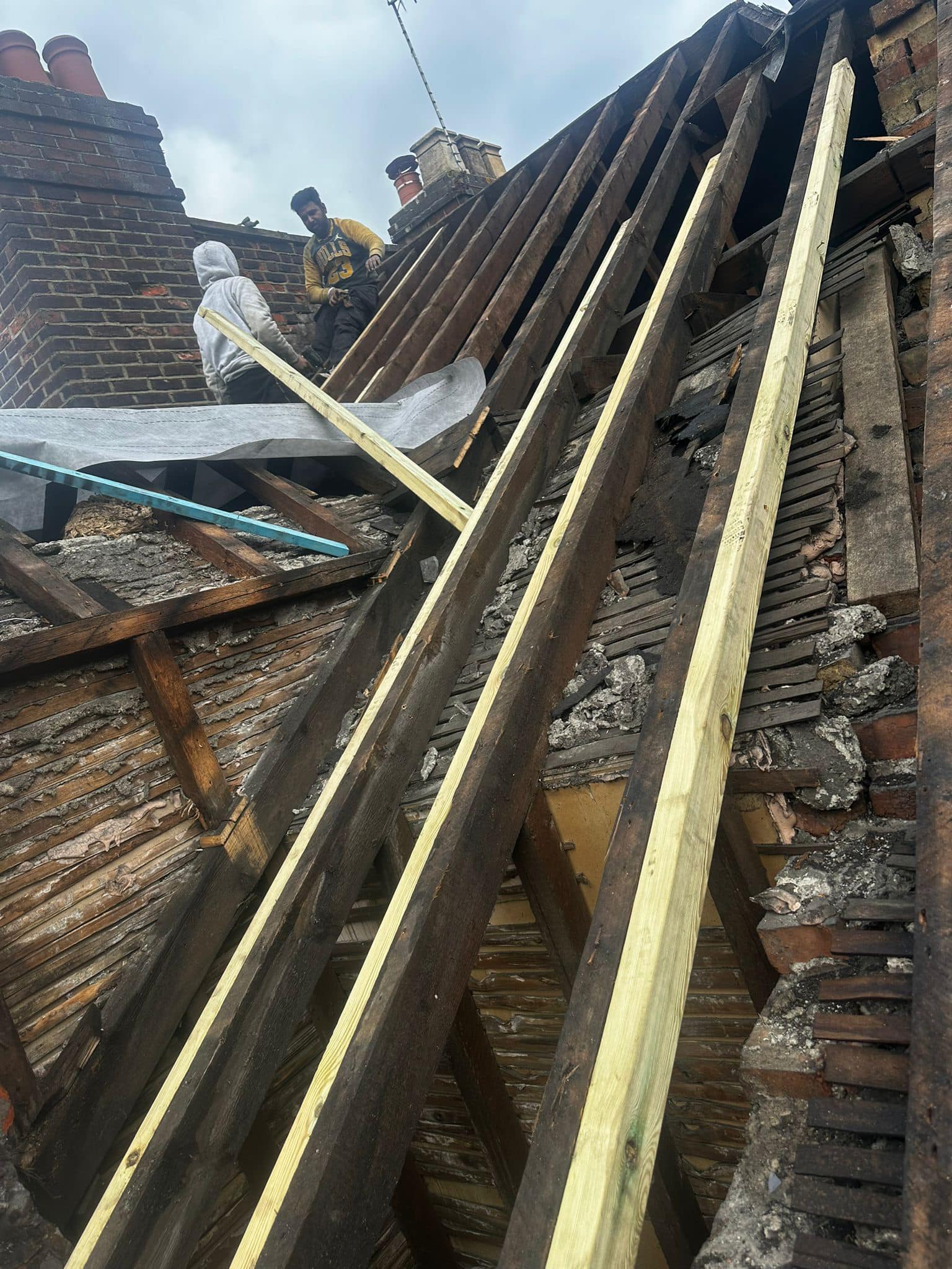 Professional roofers working on a property in London - KS Roof Master
