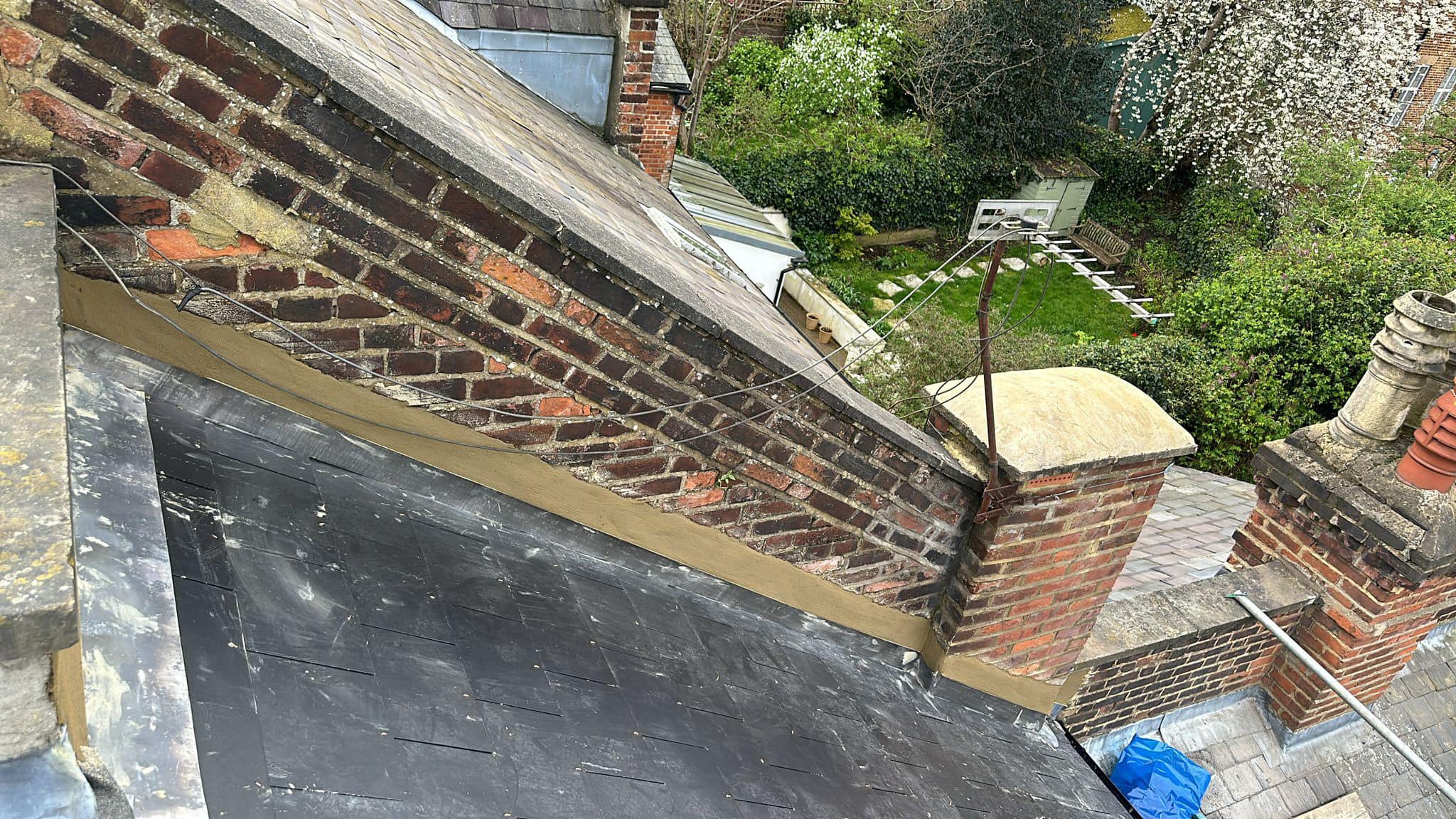 Professional roofers working on a property in London - KS Roof Master