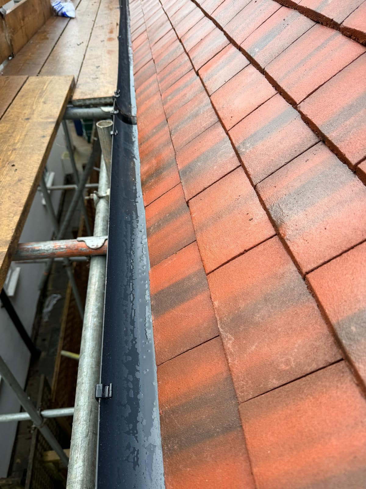 Professional roofers working on a property in London - KS Roof Master