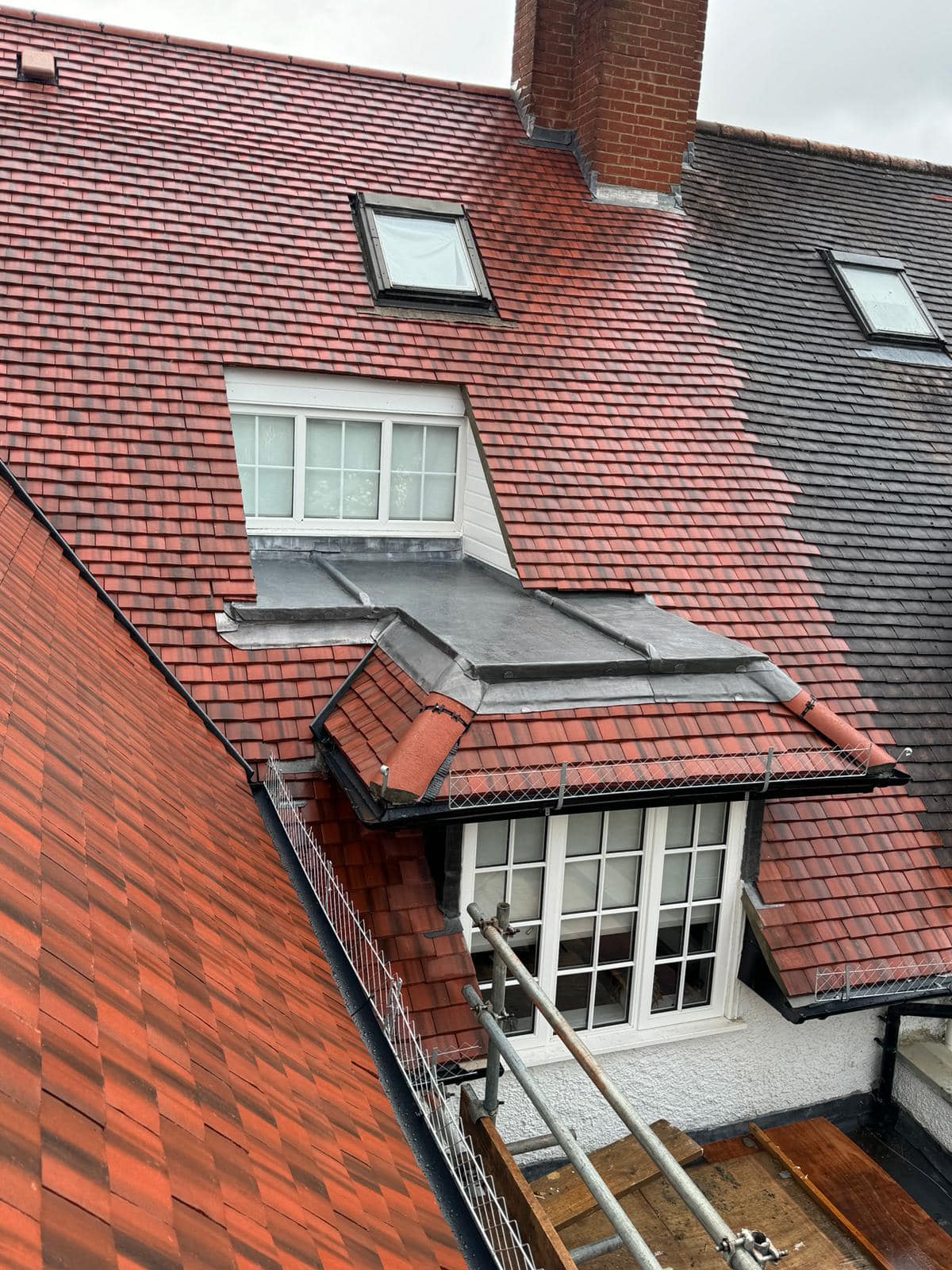 Professional roofers working on a property in London - KS Roof Master