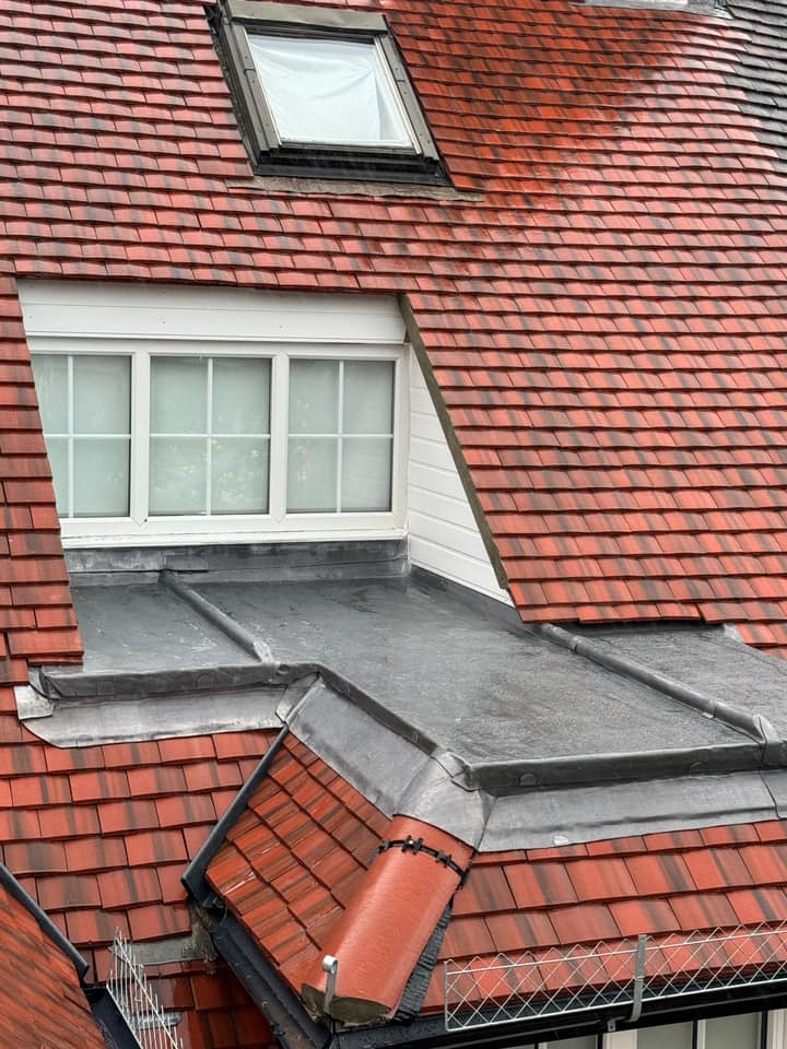Professional roofers working on a property in London - KS Roof Master