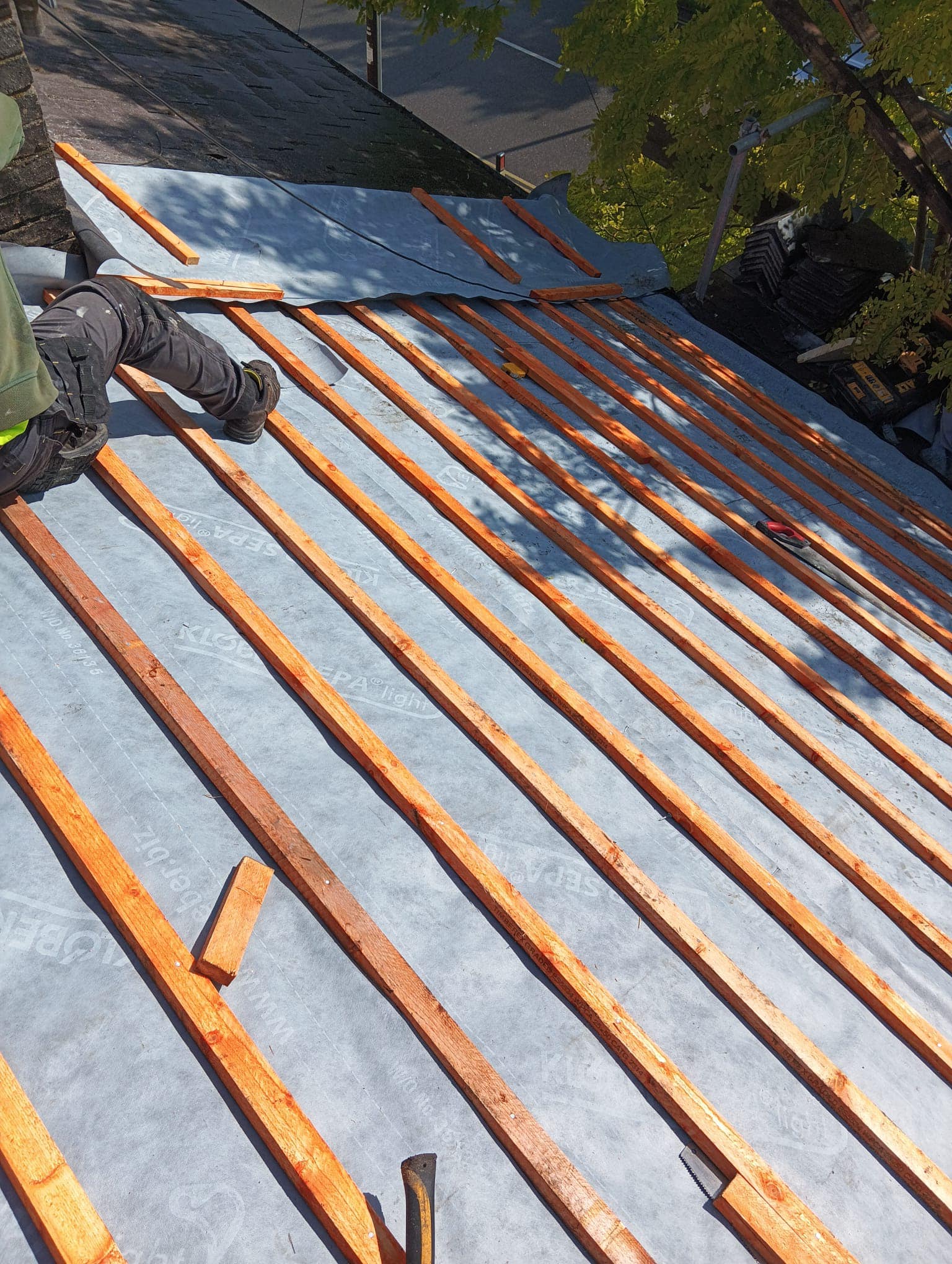 Professional roofers working on a property in London - KS Roof Master