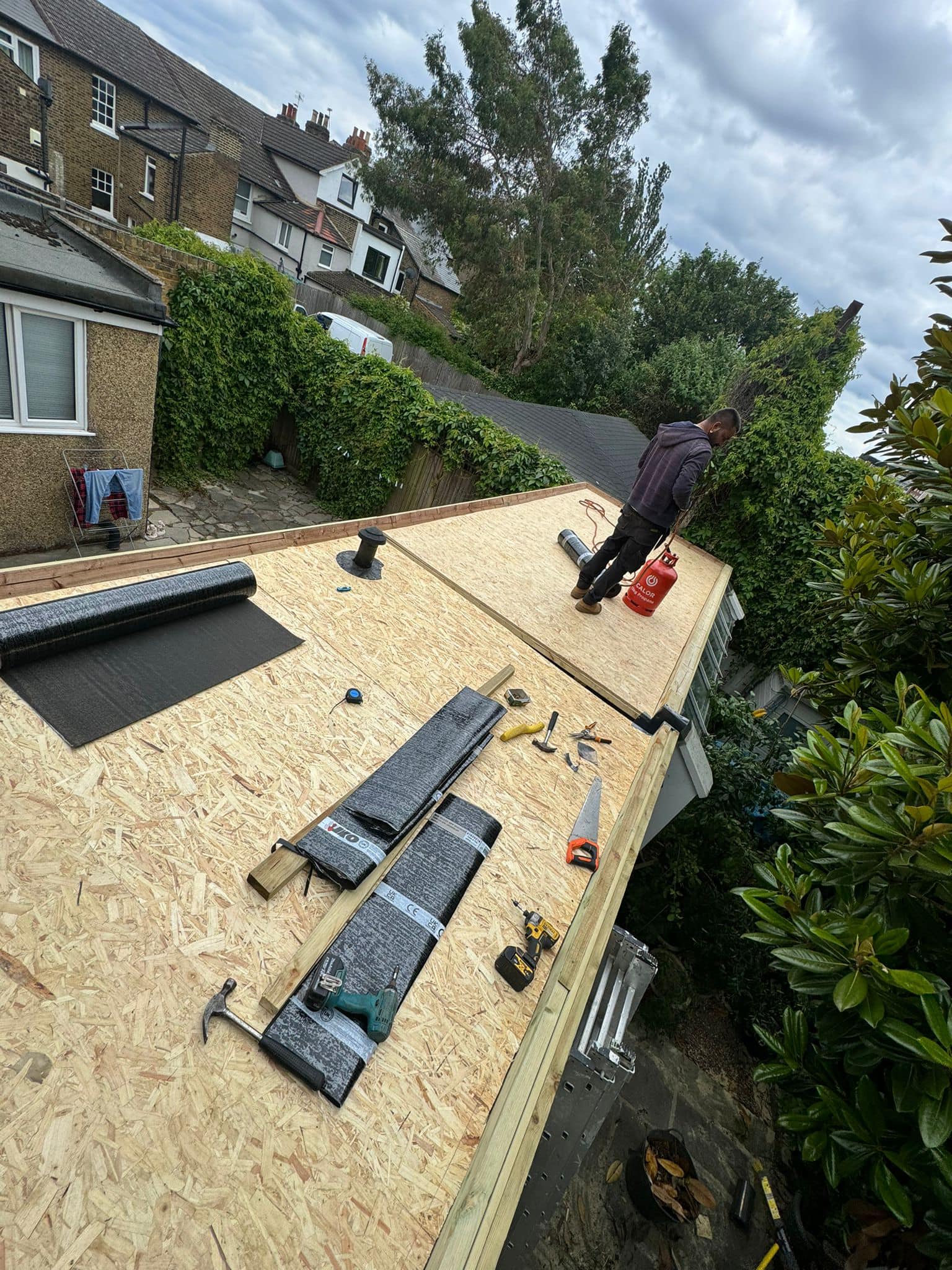 Professional roofers working on a property in London - KS Roof Master