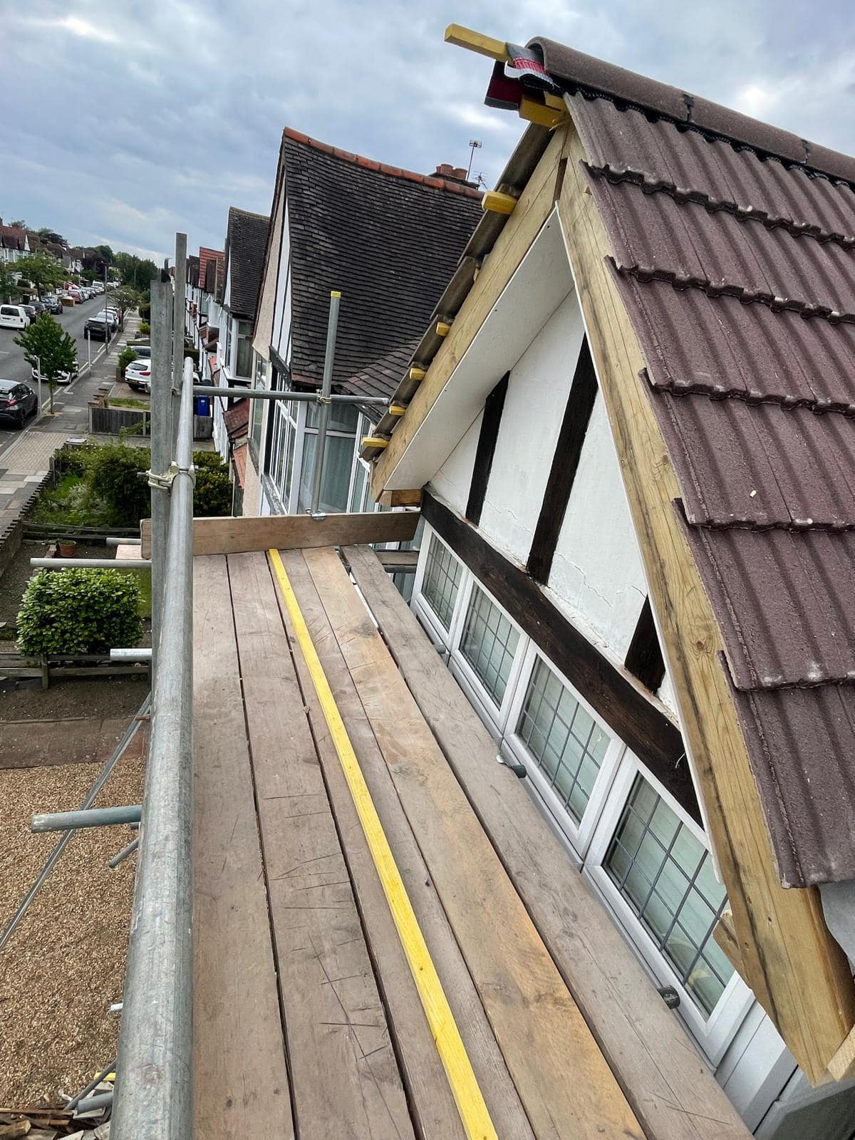 Professional roofers working on a property in London - KS Roof Master