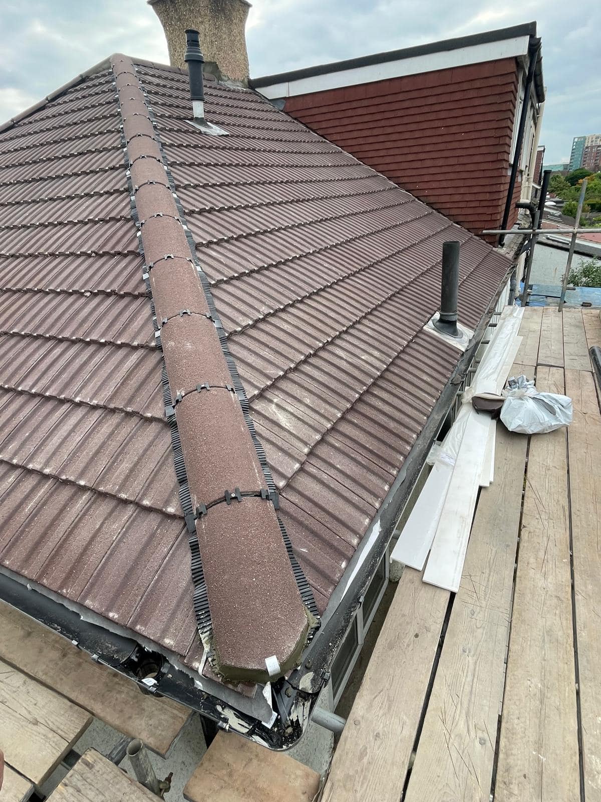 Professional roofers working on a property in London - KS Roof Master