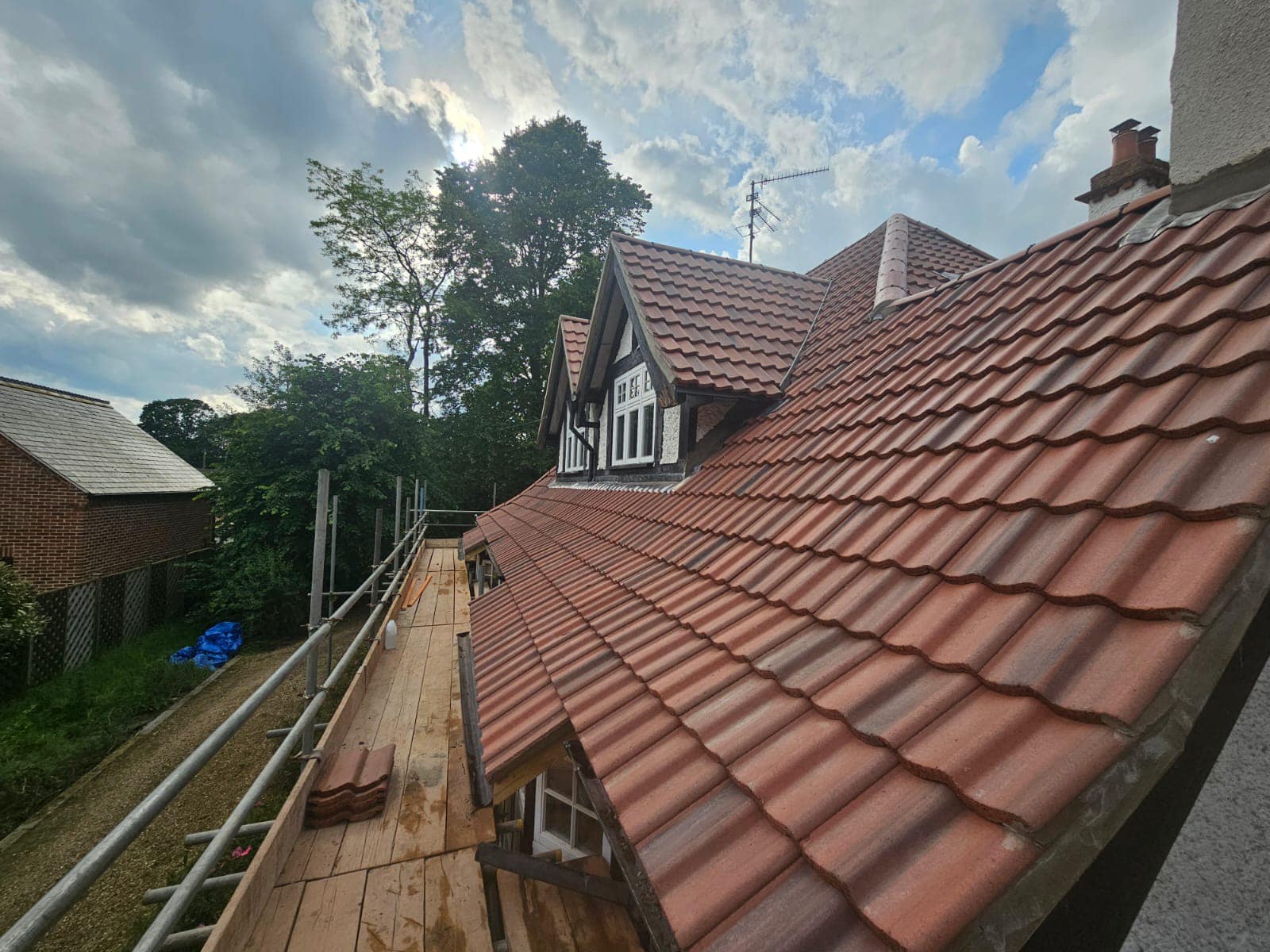 Professional roofers working on a property in London - KS Roof Master