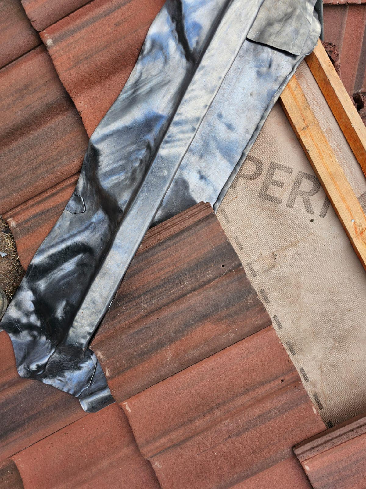 Professional roofers working on a property in London - KS Roof Master