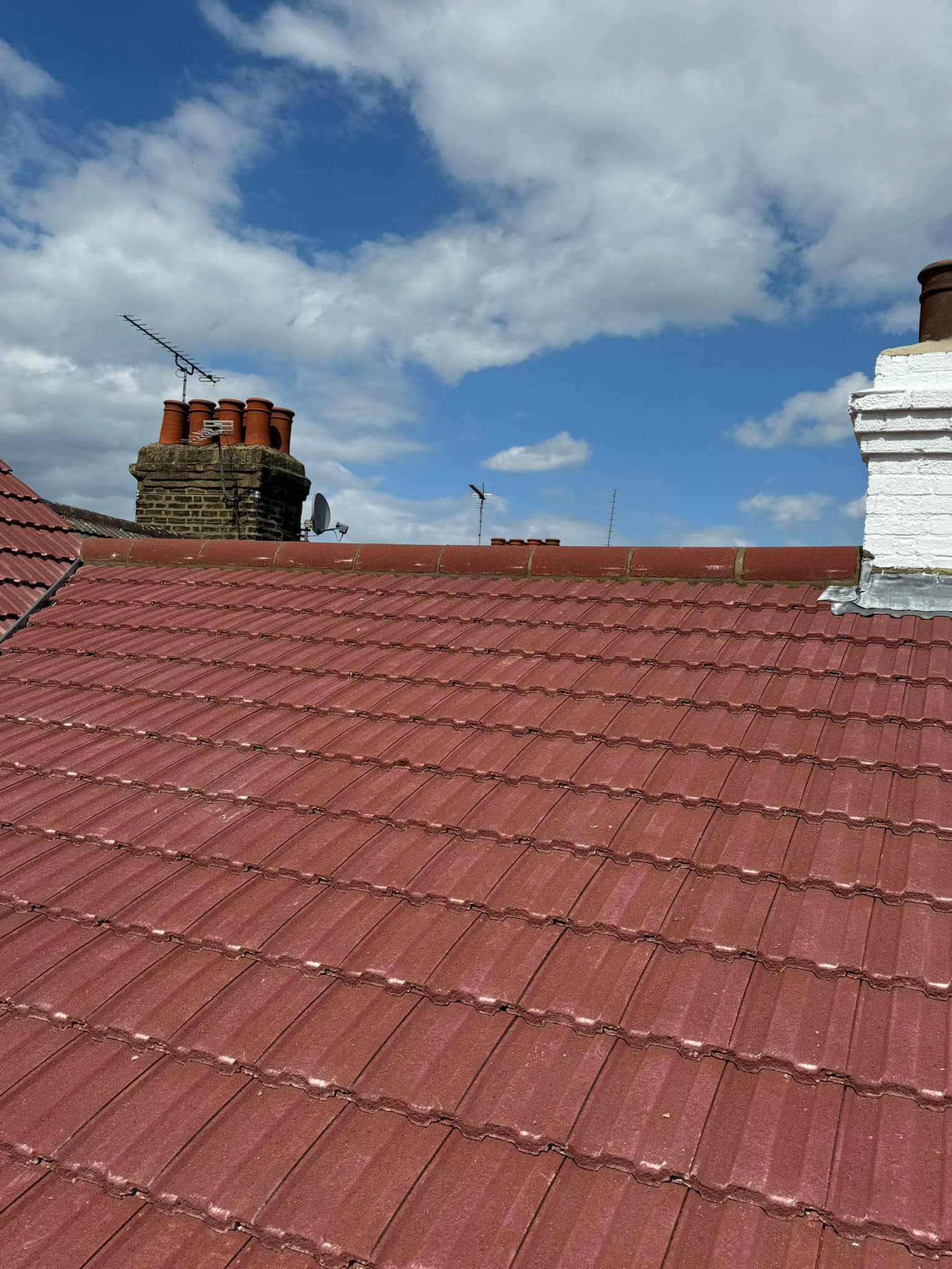 Professional roofers working on a property in London - KS Roof Master