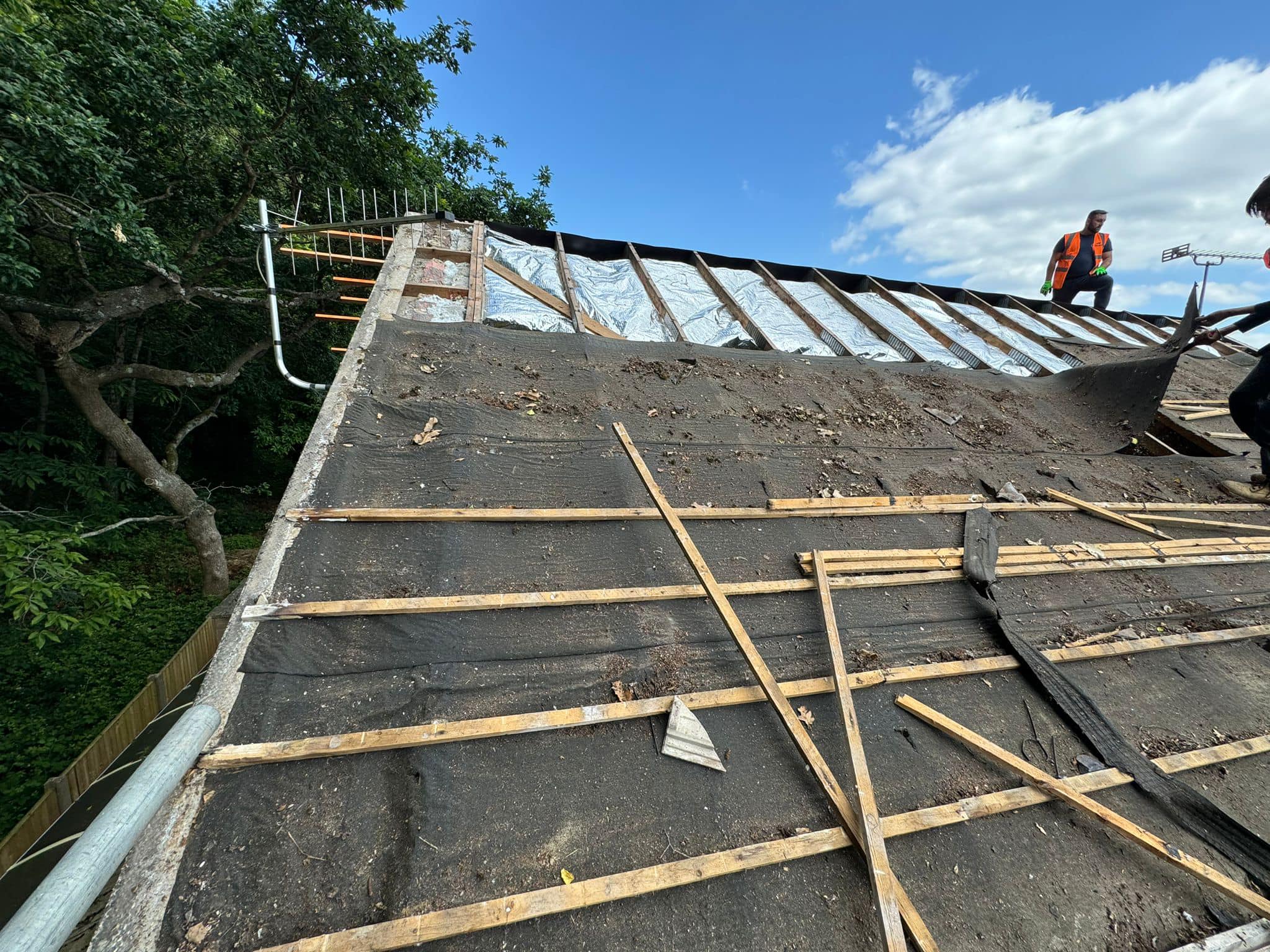 Professional roofers working on a property in London - KS Roof Master