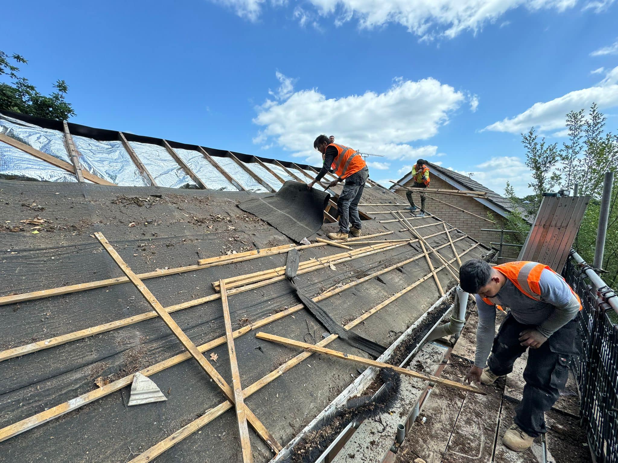 Professional roofers working on a property in London - KS Roof Master