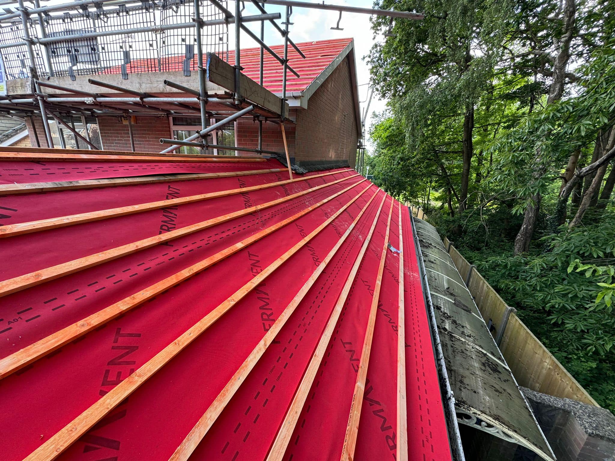 Professional roofers working on a property in London - KS Roof Master