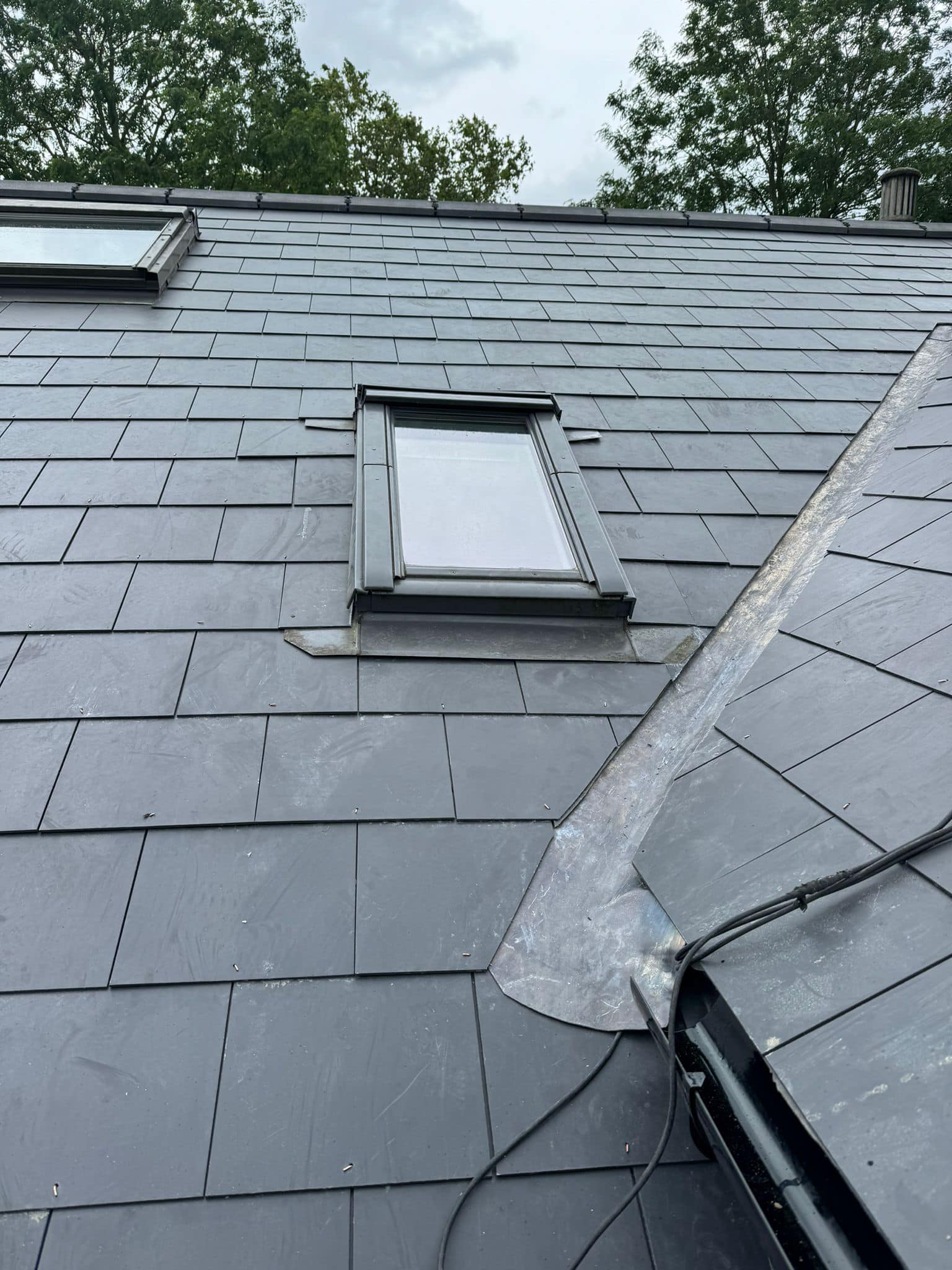 Professional roofers working on a property in London - KS Roof Master