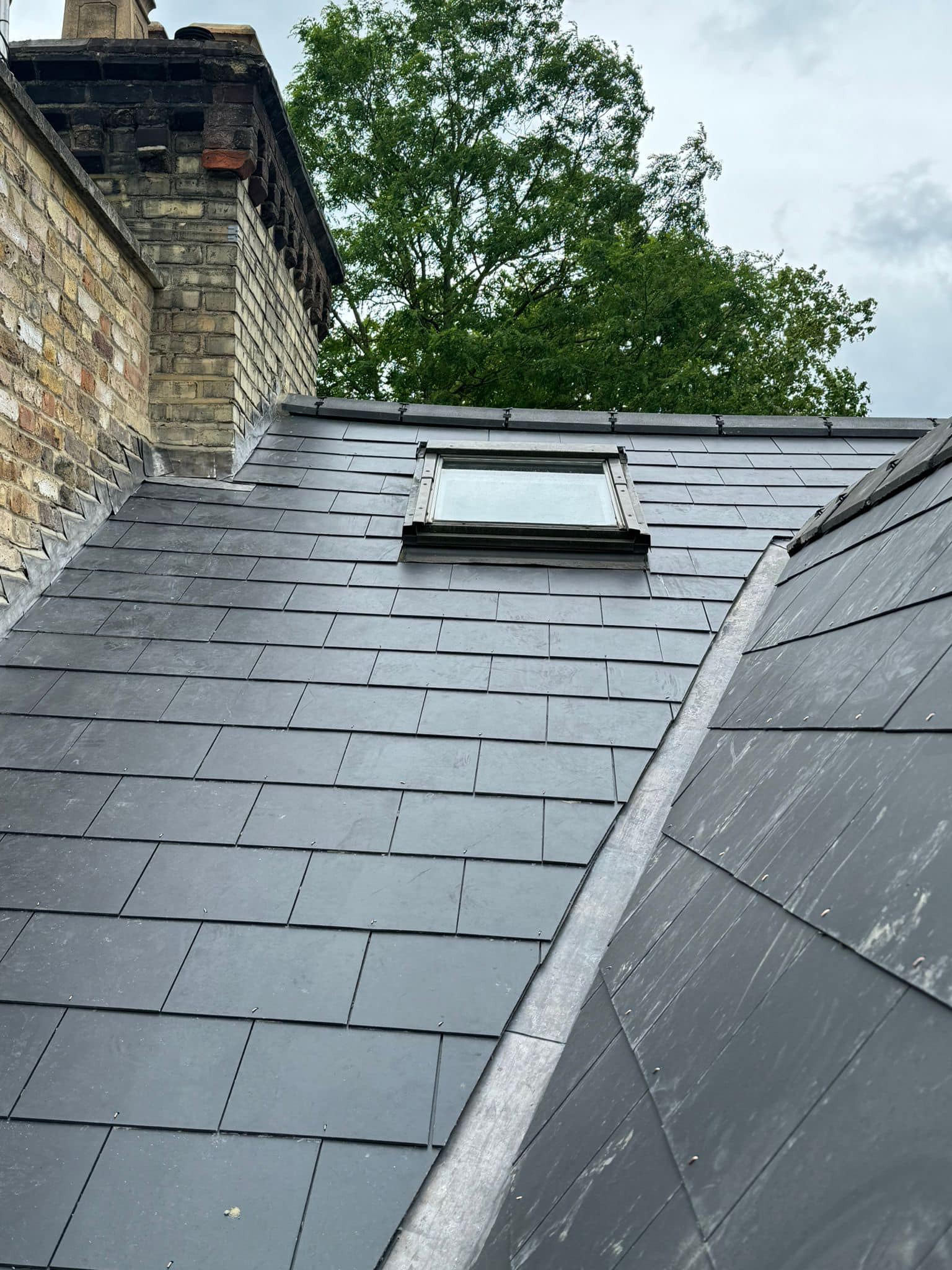 Professional roofers working on a property in London - KS Roof Master