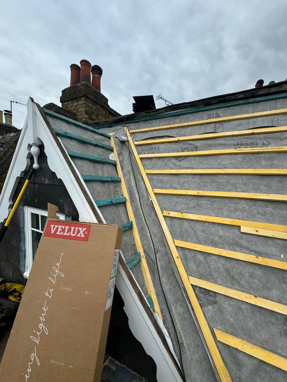Professional roofers working on a property in London - KS Roof Master