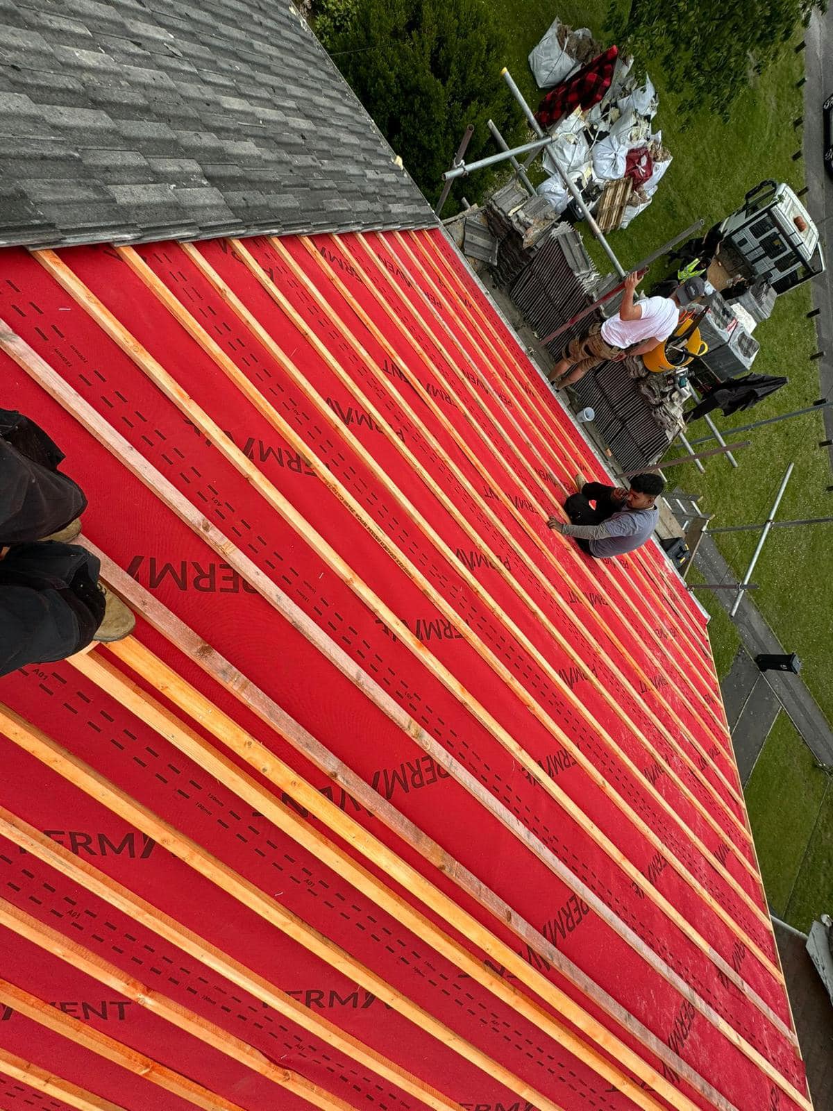 Professional roofers working on a property in London - KS Roof Master