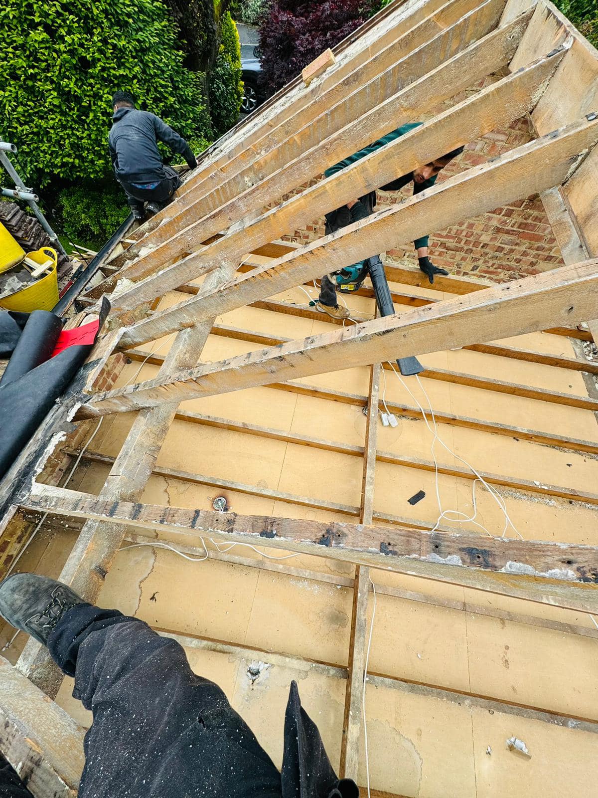 Professional roofers working on a property in London - KS Roof Master