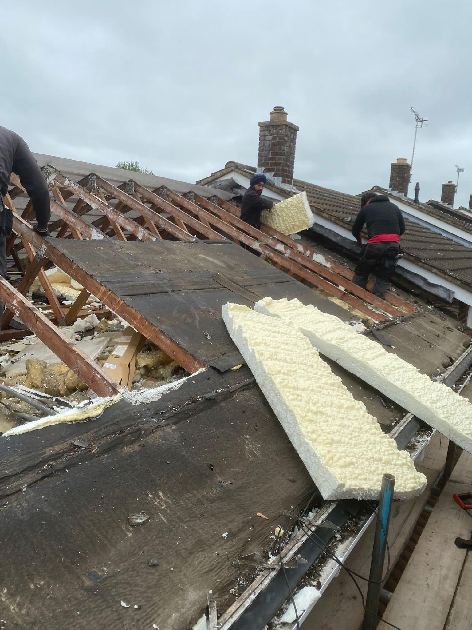 Professional roofers working on a property in London - KS Roof Master