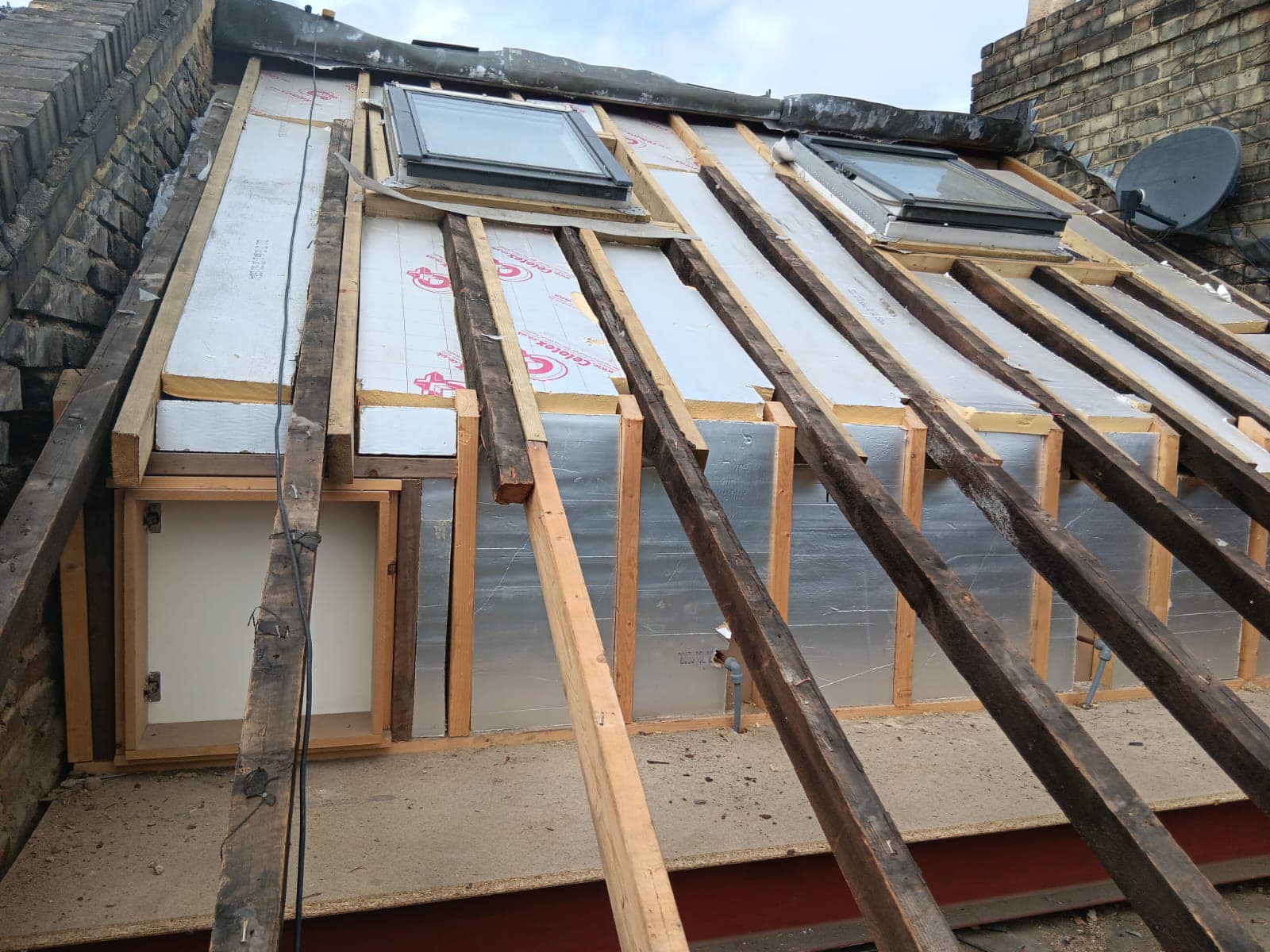 Professional roofers working on a property in London - KS Roof Master