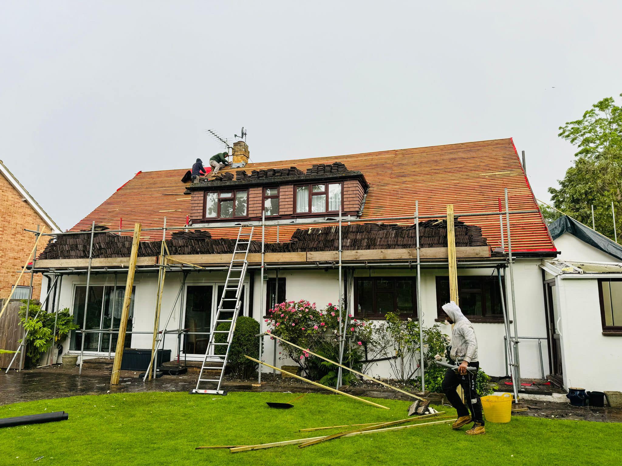 Professional roofers working on a property in London - KS Roof Master