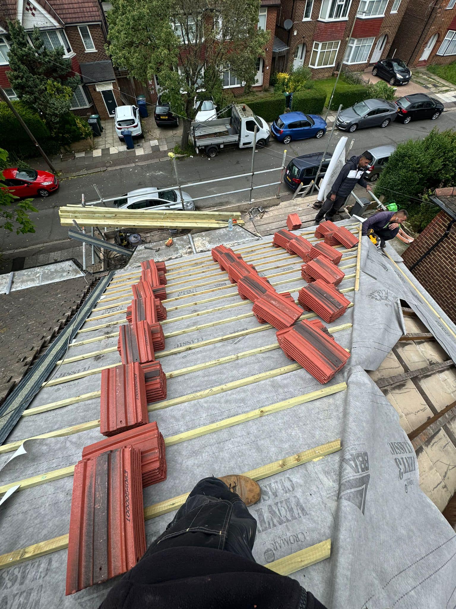 Professional roofers working on a property in London - KS Roof Master