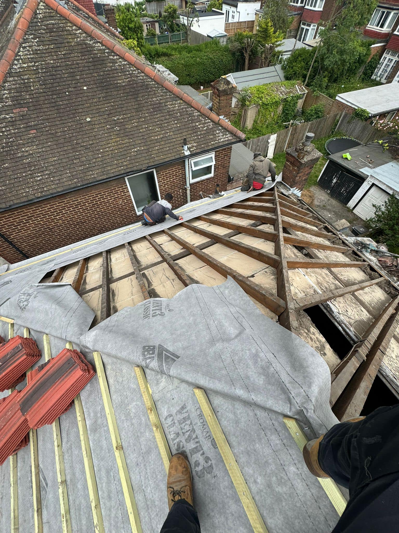 Professional roofers working on a property in London - KS Roof Master