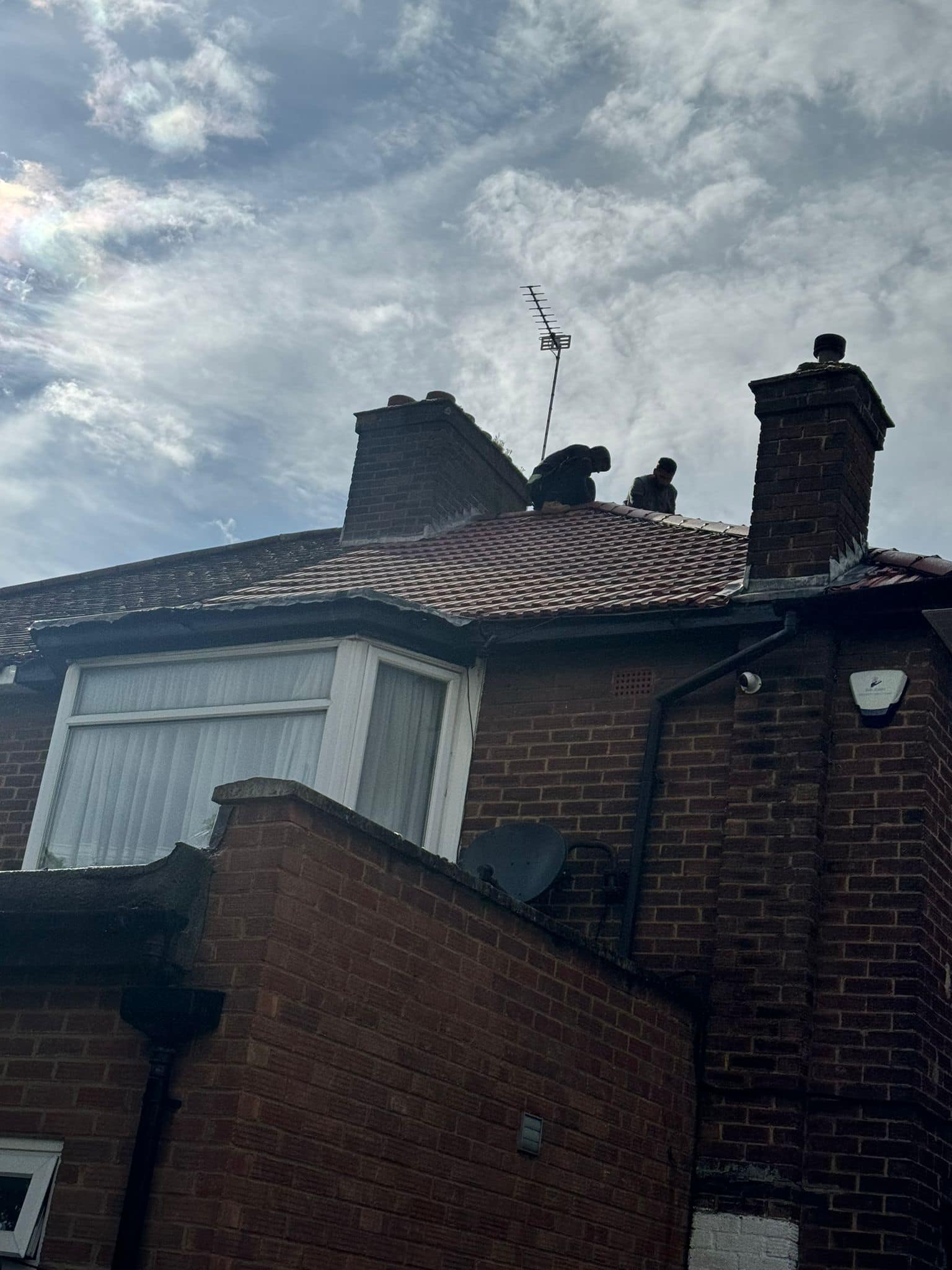 Professional roofers working on a property in London - KS Roof Master