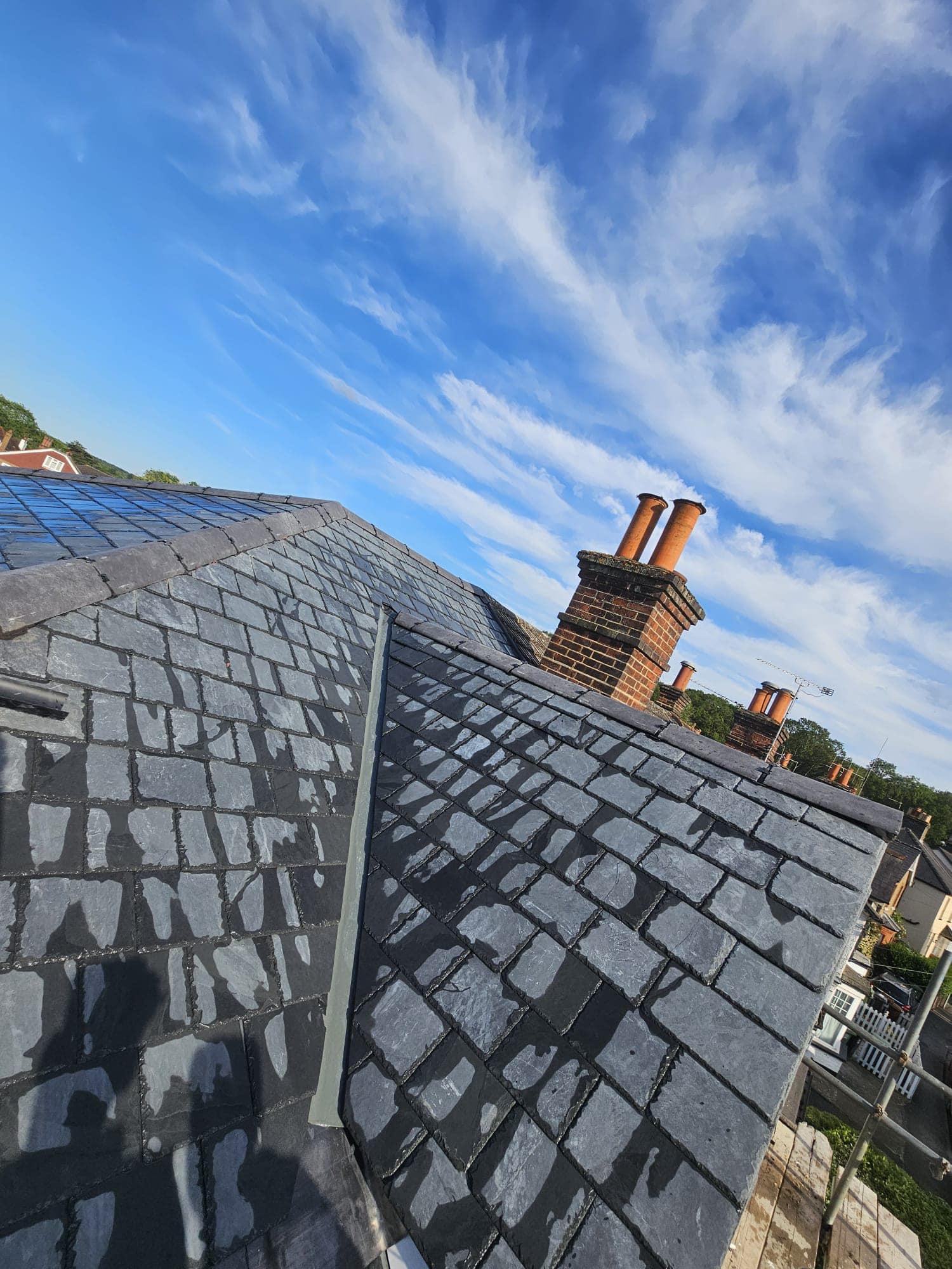 Professional roofers working on a property in London - KS Roof Master