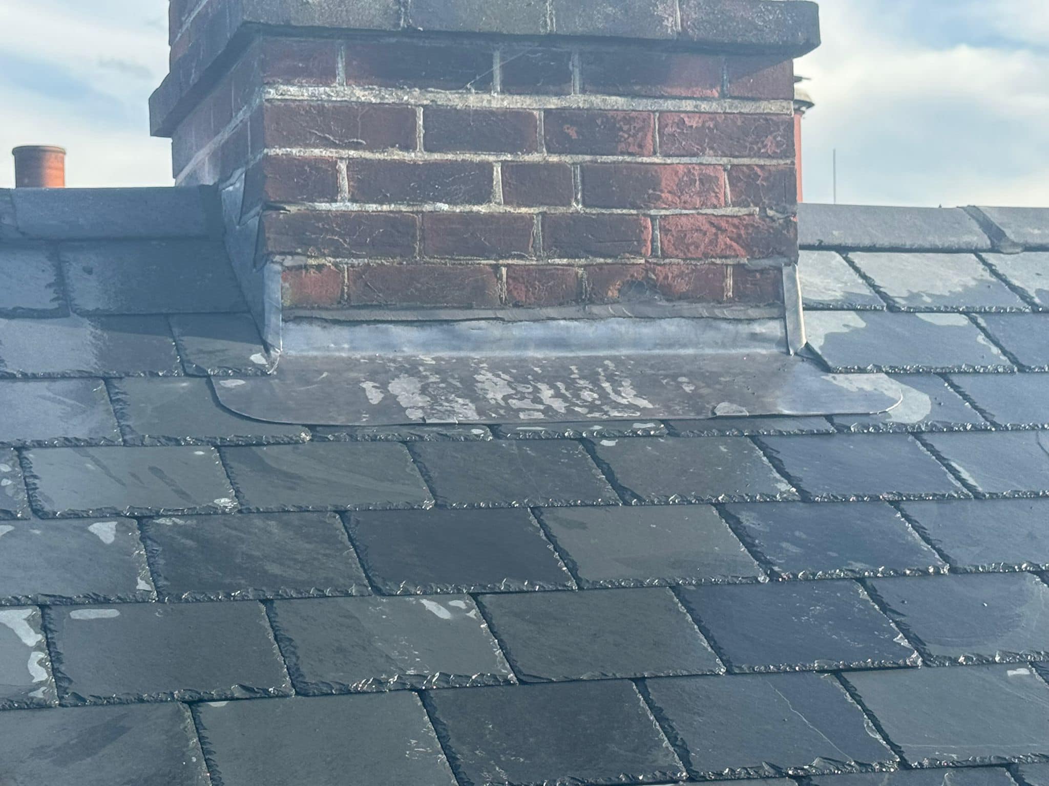 Professional roofers working on a property in London - KS Roof Master