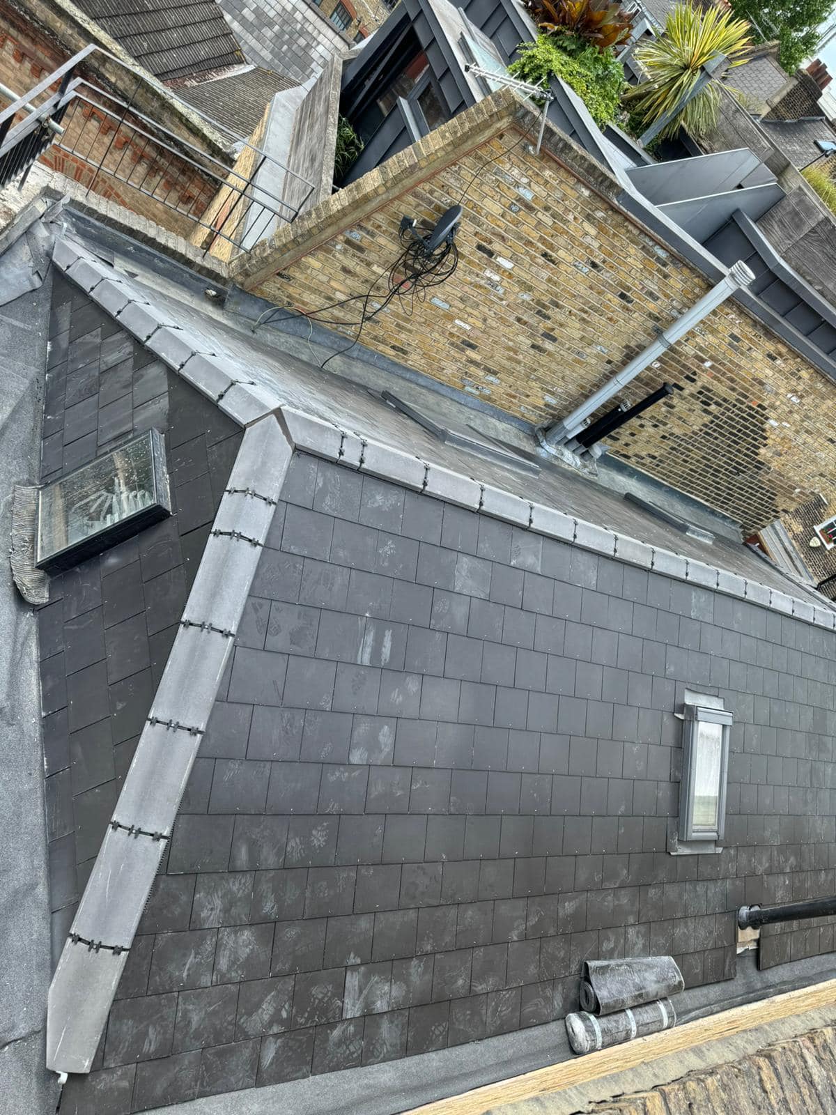 Professional roofers working on a property in London - KS Roof Master