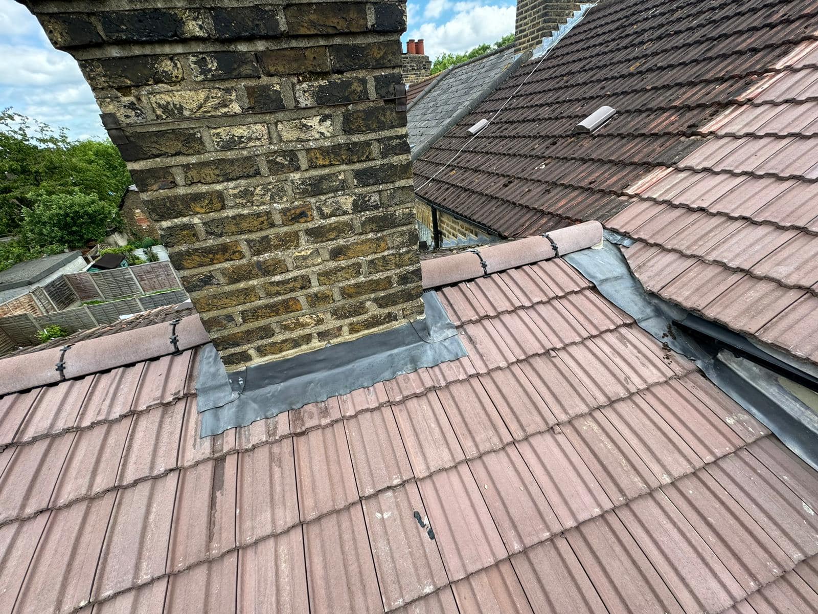 Professional roofers working on a property in London - KS Roof Master