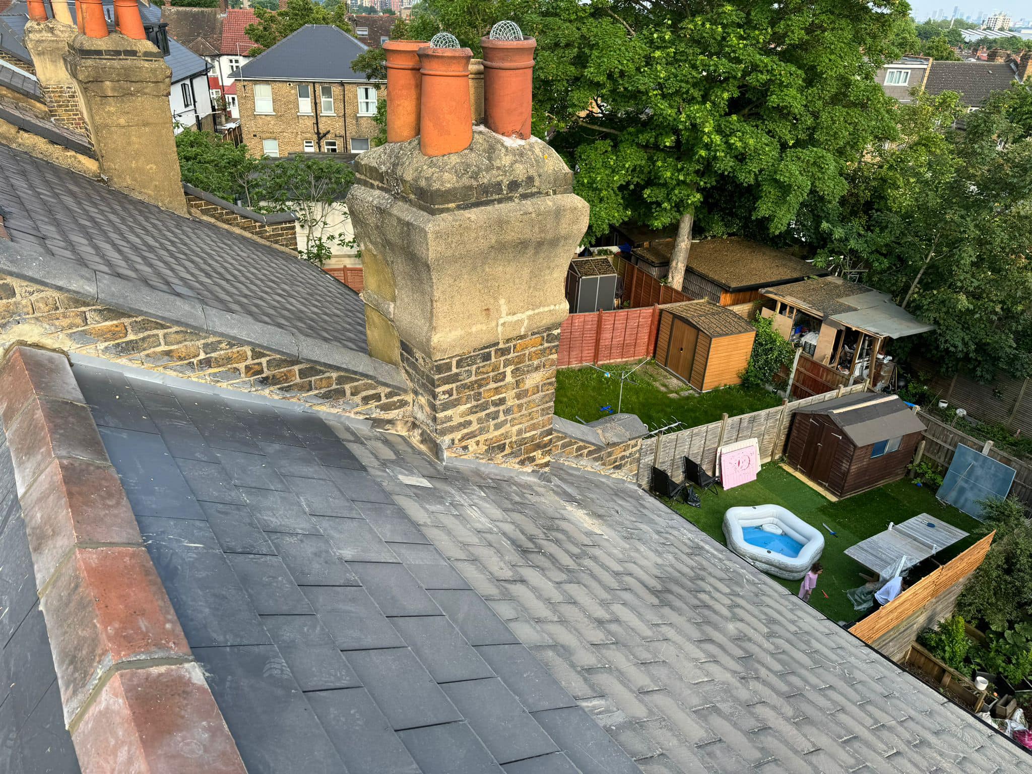 Professional roofers working on a property in London - KS Roof Master