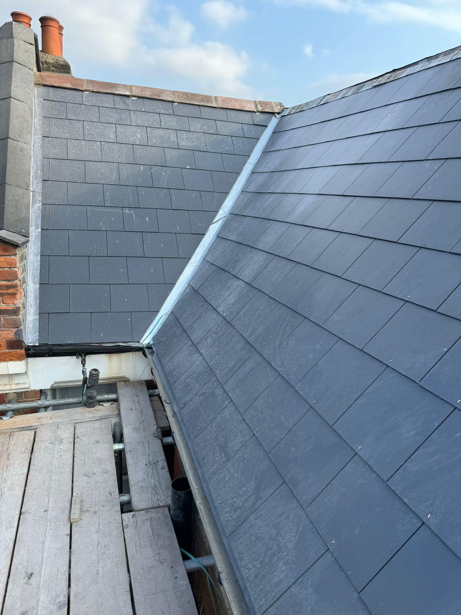 Professional roofers working on a property in London - KS Roof Master