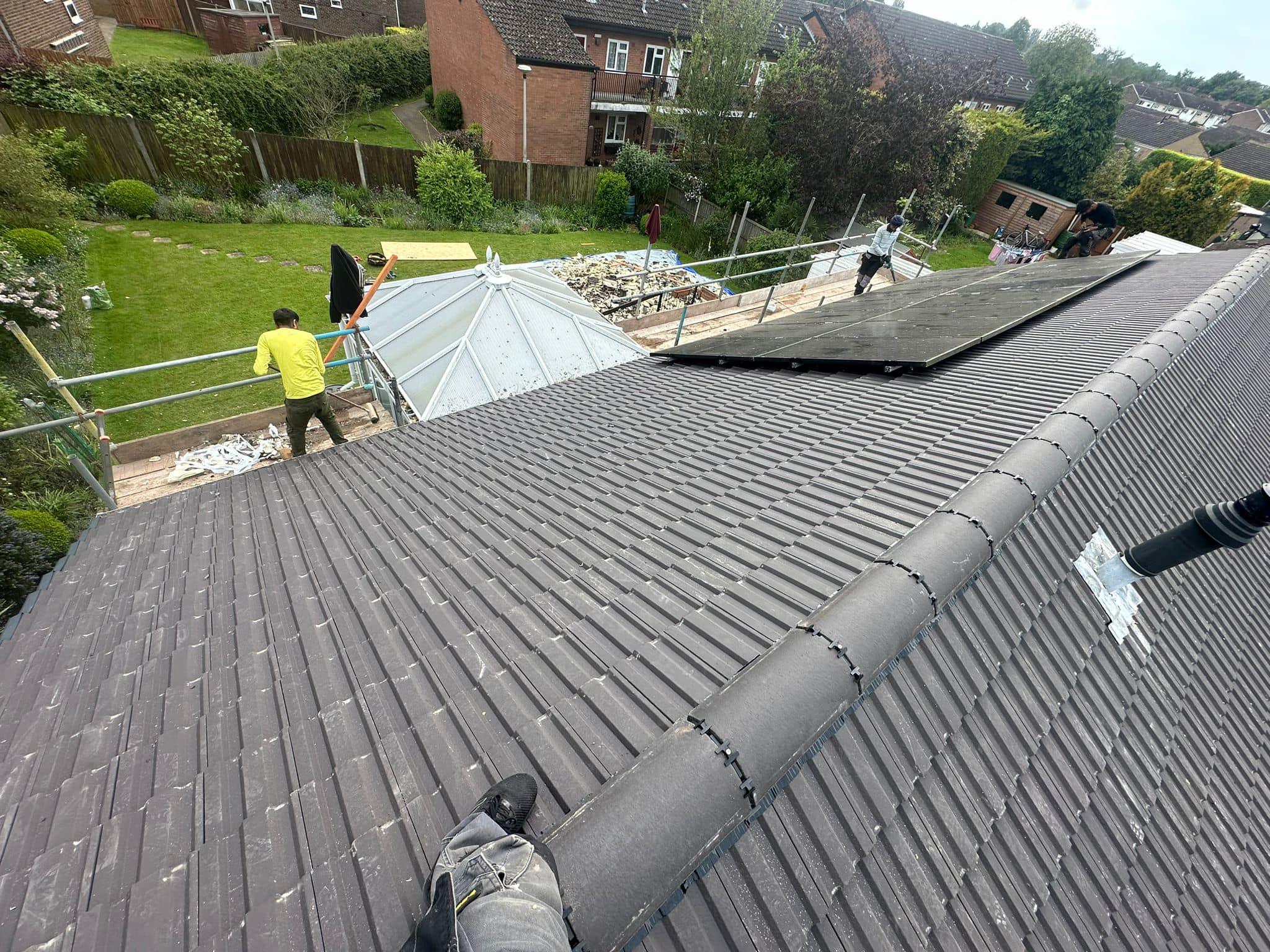 Professional roofers working on a property in London - KS Roof Master