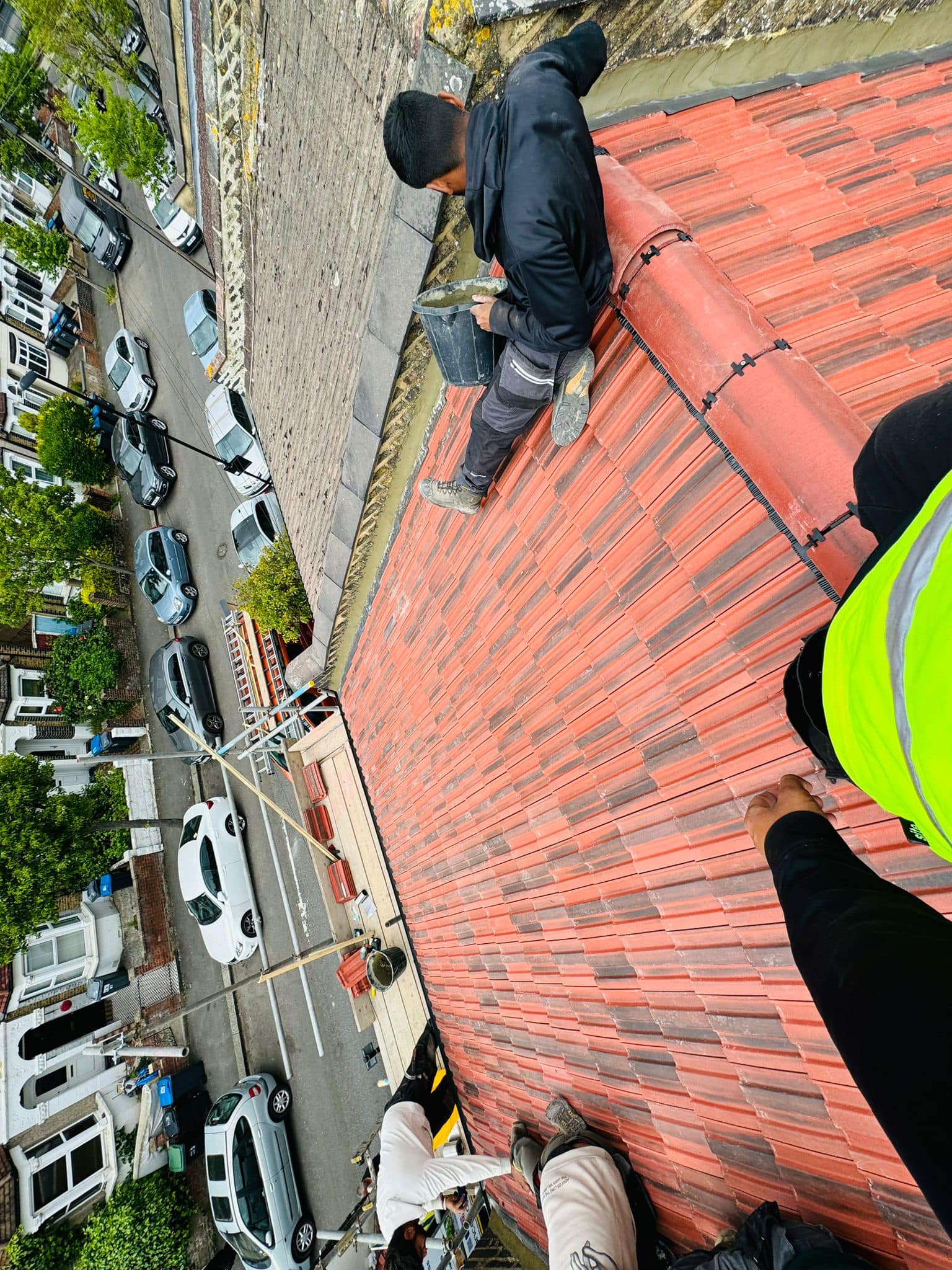 Professional roofers working on a property in London - KS Roof Master
