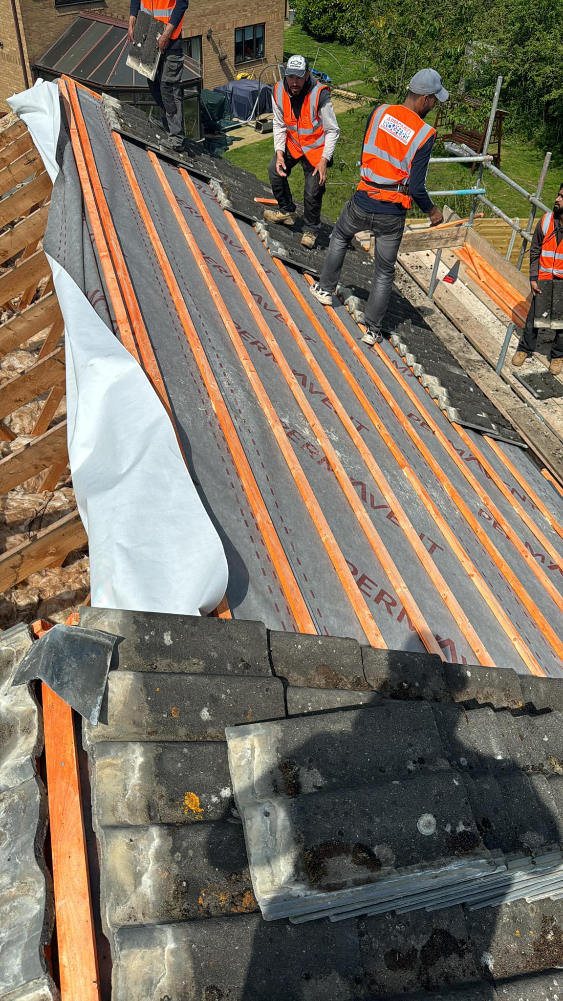 Professional roofers working on a property in London - KS Roof Master