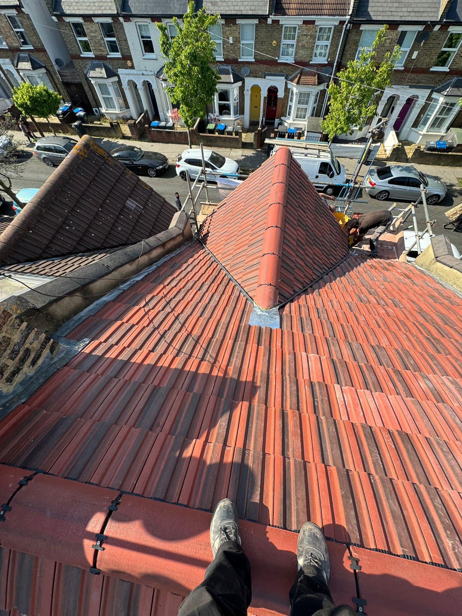 Professional roofers working on a property in London - KS Roof Master