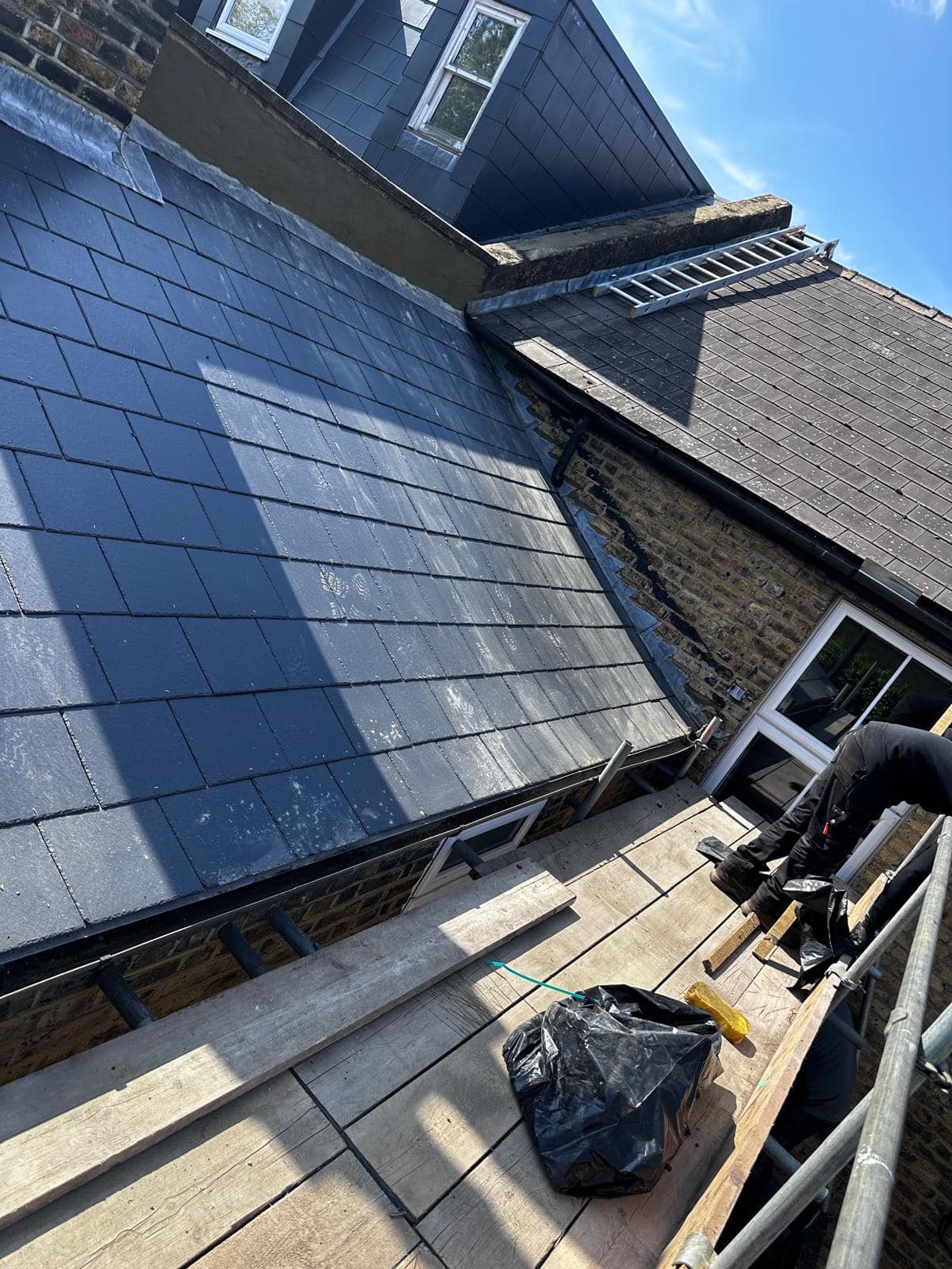 Professional roofers working on a property in London - KS Roof Master