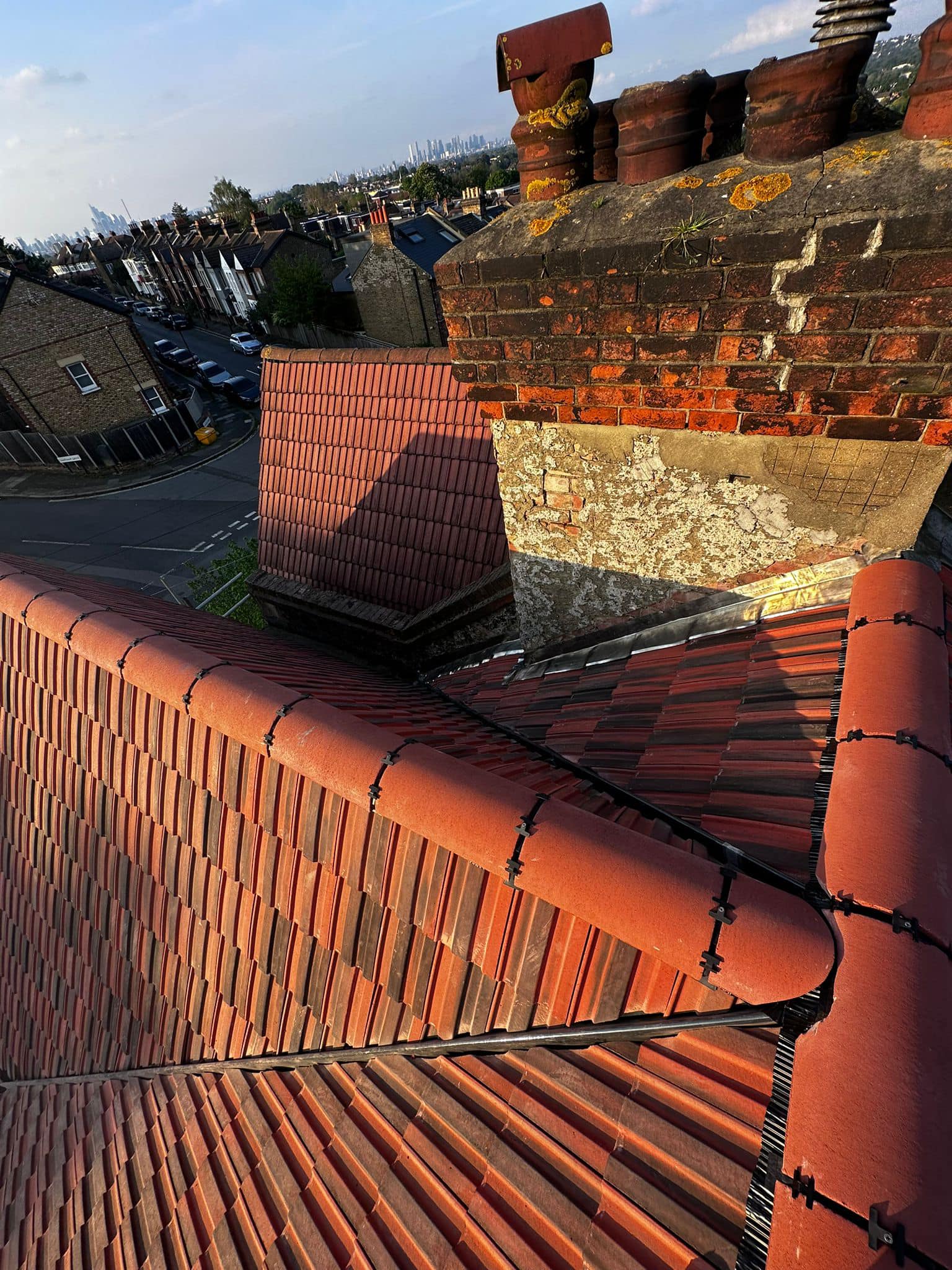 Professional roofers working on a property in London - KS Roof Master