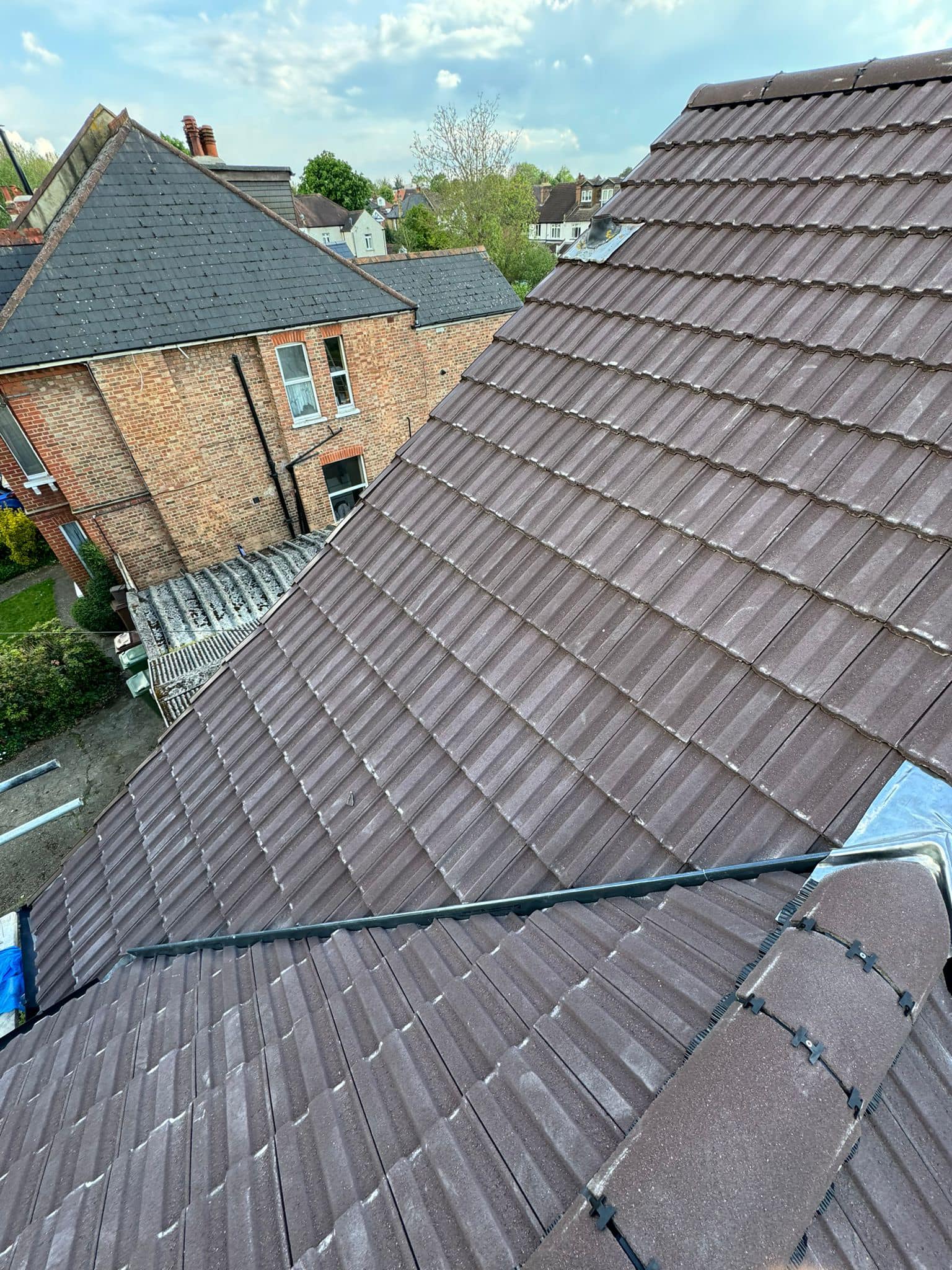 Professional roofers working on a property in London - KS Roof Master