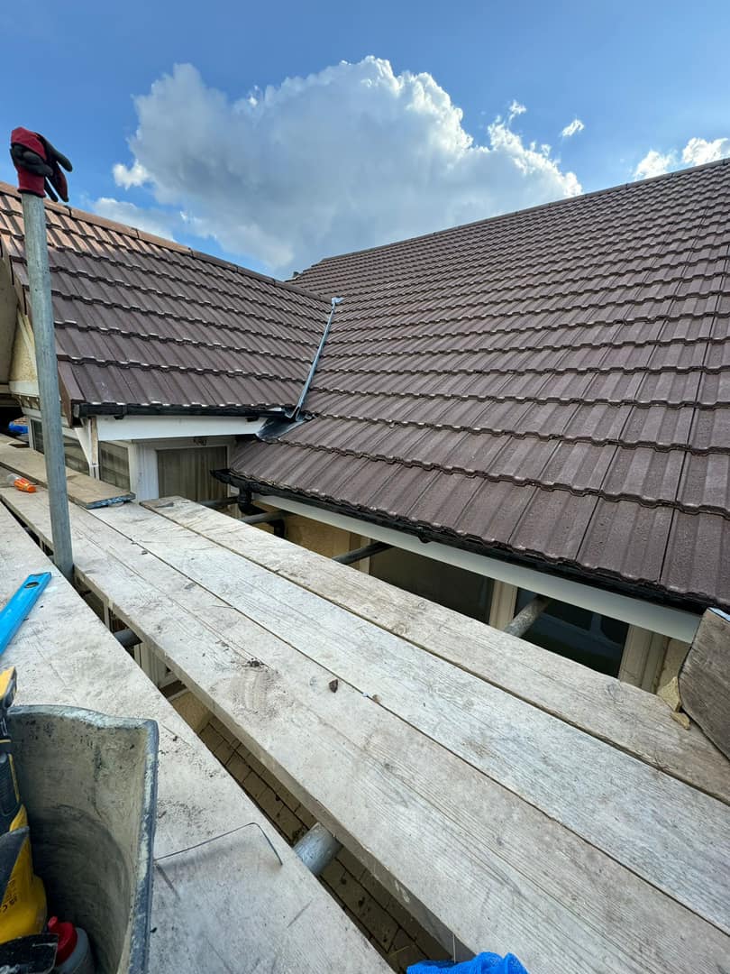 Professional roofers working on a property in London - KS Roof Master