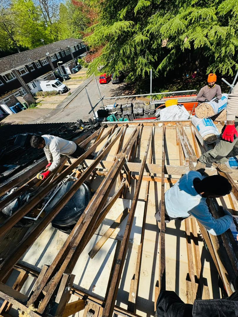 Professional roofers working on a property in London - KS Roof Master