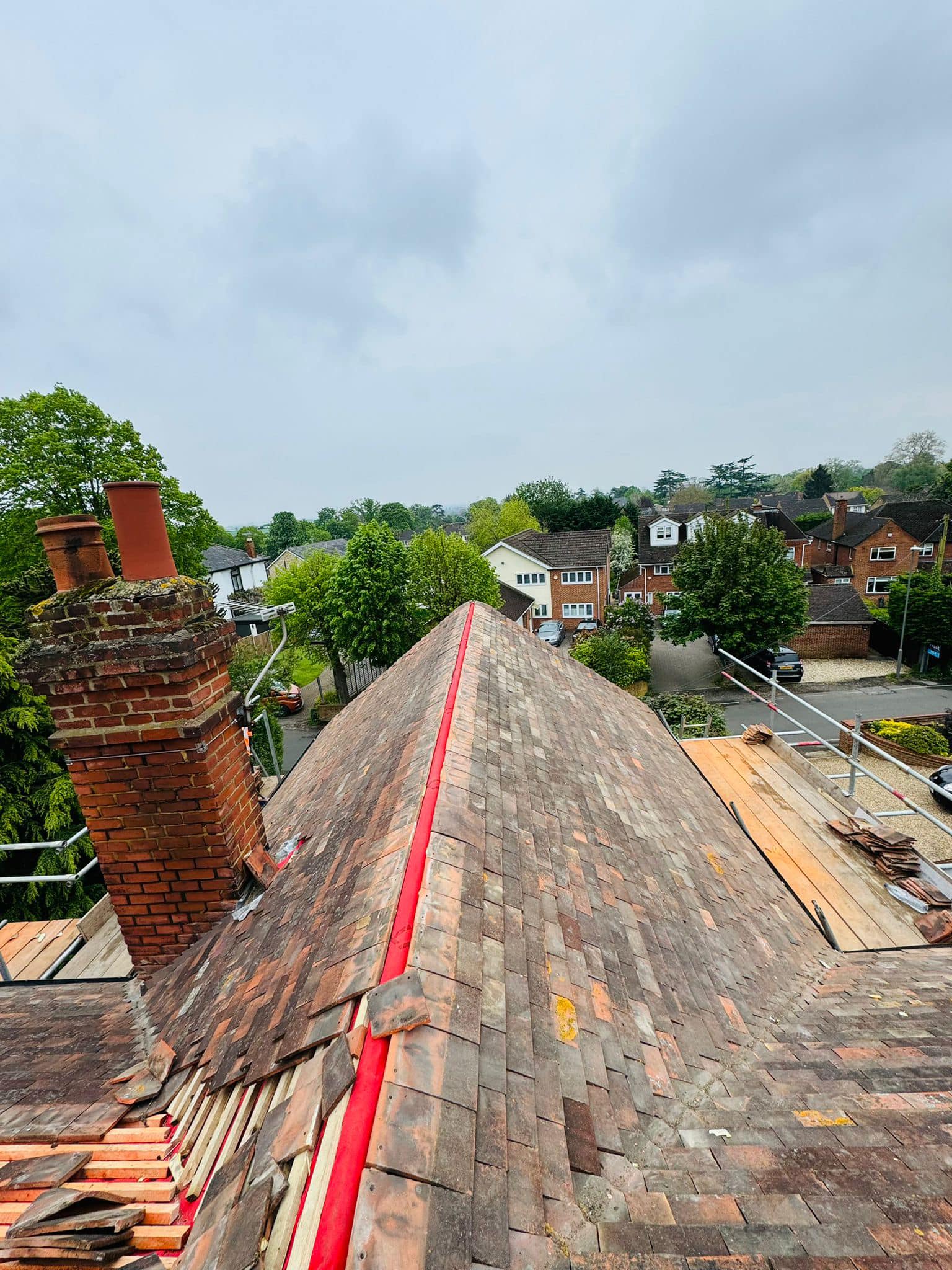 Professional roofers working on a property in London - KS Roof Master