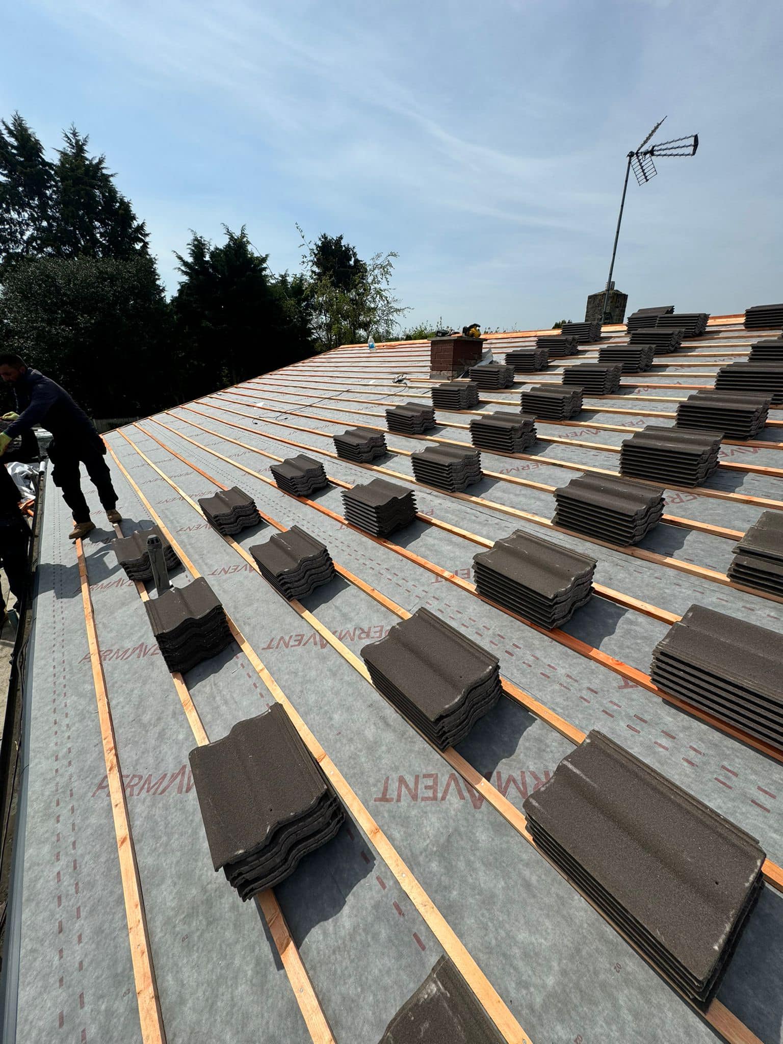 Professional roofers working on a property in London - KS Roof Master