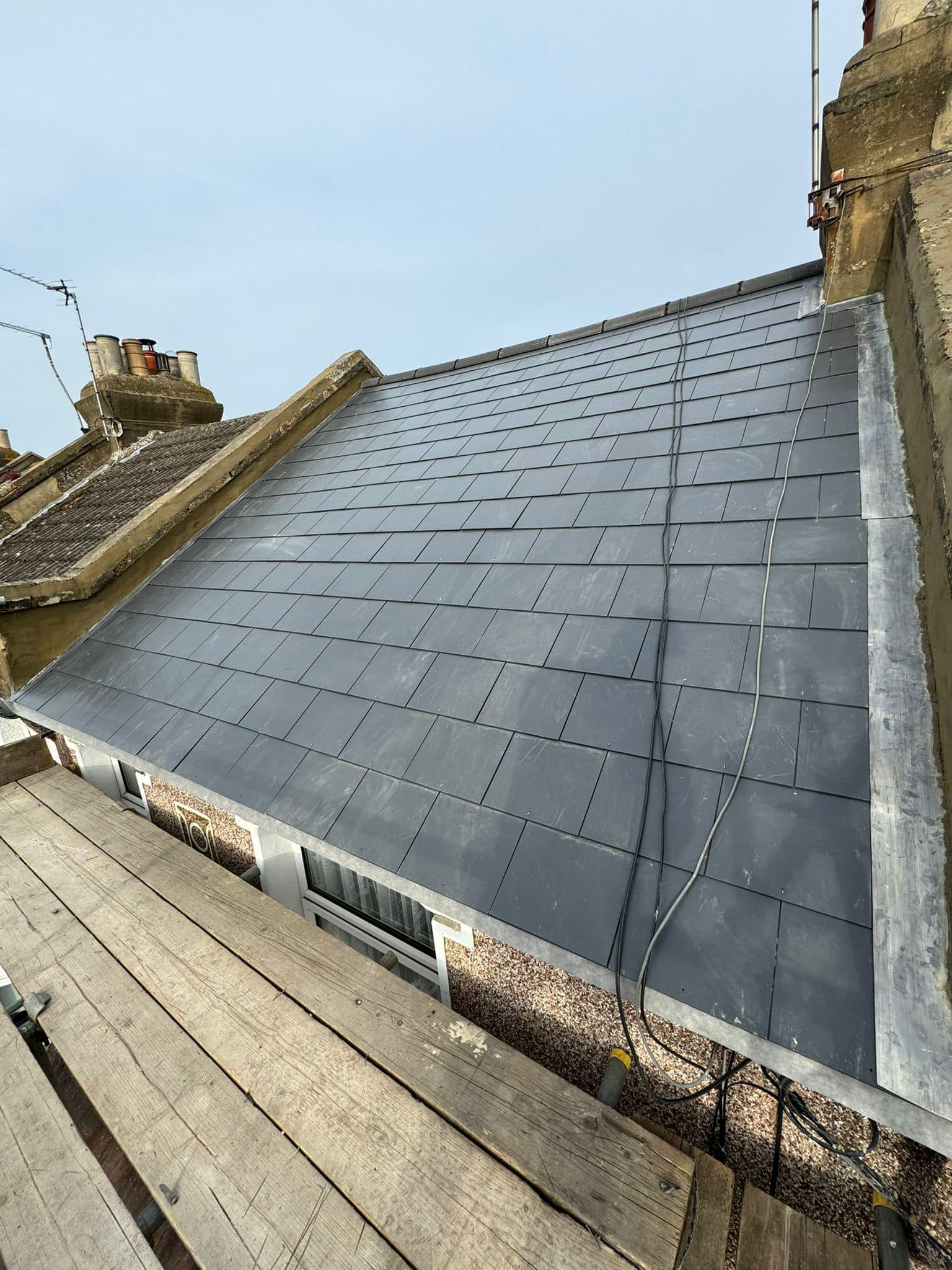 Professional roofers working on a property in London - KS Roof Master