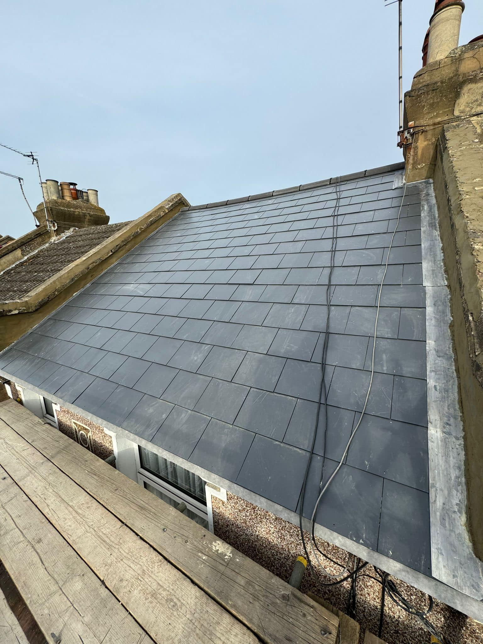 Professional roofers working on a property in London - KS Roof Master