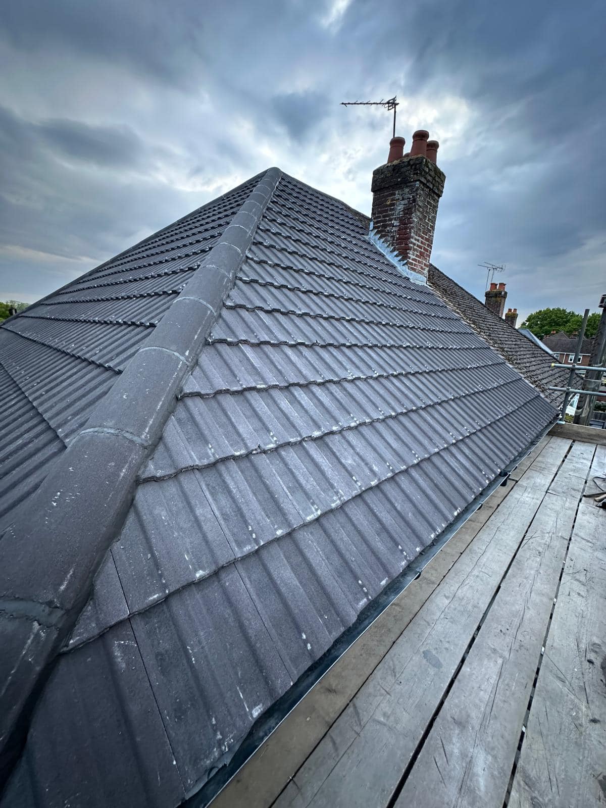 Professional roofers working on a property in London - KS Roof Master