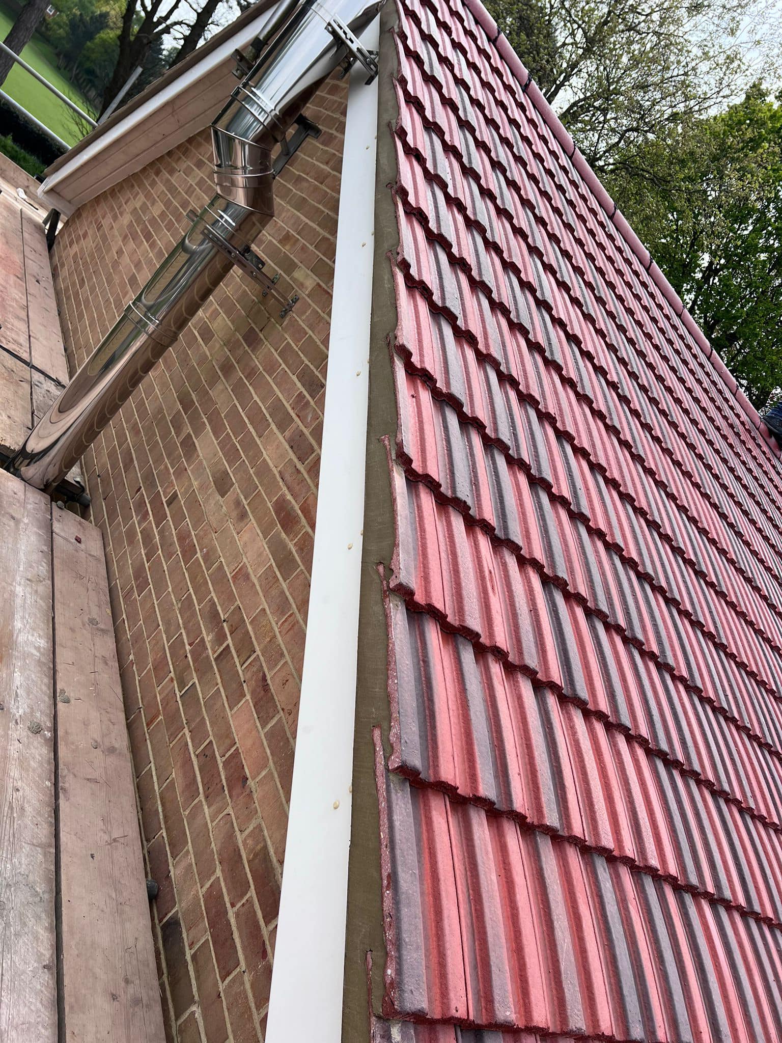 Professional roofers working on a property in London - KS Roof Master